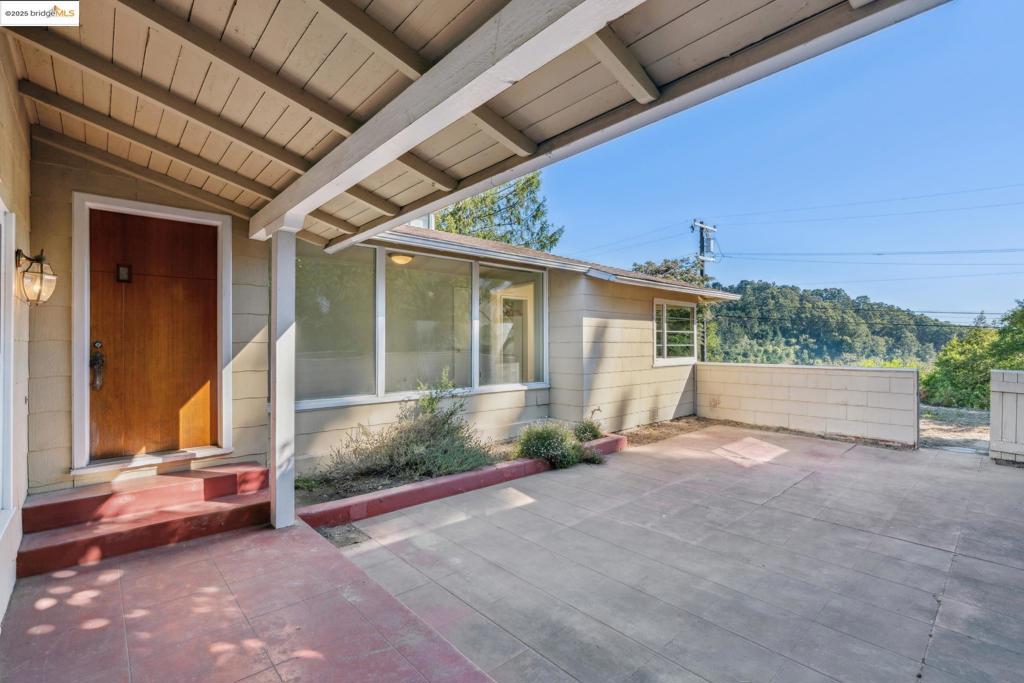 119 Villanova Drive is your opportunity to create a personal oasis, where peace, privacy, and potential converge. Nestled at the edge of the Huckleberry Botanic Regional Preserve, it is easy to envision this home’s full potential. A bright home featuring cathedral ceilings, Bay views, and a generous front courtyard that opens out from the living room, creating a sought-after indoor/outdoor California living lifestyle. The 1,786 sq ft* home offers 2 bedrooms, 1 bathroom on the main level, and a bonus room**, half bath, and workshop space, as well as a 2-car garage downstairs. There is also a spacious dining room and kitchen, laundry room, and pantry area affording amazing reconfiguration options when you are ready to remodel. As a cosmetic fixer, you have the rare opportunity to personalize every surface and space to your taste, to the highest and best use of the property, all while building real equity. The home can be accessed via the 2-car attached garage on Villanova Lane or the Villanova Road steps, where the front garden and courtyard overlook the regional preserve. With a little investment, you can end up with something exceptional. Live above the clouds. Invest in yourself. And let your imagination soar. Open 8/10 & 8/17 from 2-4:30 PM.