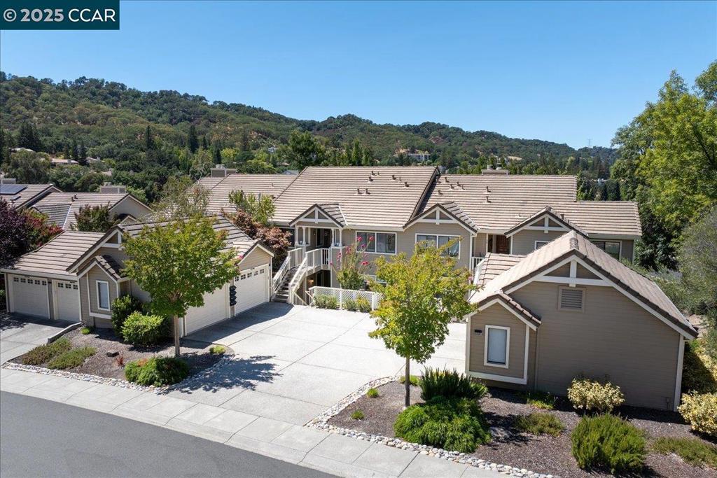 Welcome to a rare and beautifully appointed Montrose condo in Turnberry, one of Rossmoor’s most desirable neighborhoods! This charming home offers views of pristine fairways through expansive picture windows, in a serene setting above the 10th hole of the Dollar Golf Course, on popular entry 25. Step into the updated eat-in kitchen, where granite countertops, custom cabinetry, a breakfast bar, recessed lighting, and a cheerful breakfast nook create a perfect space for casual meals and morning coffee, all with a view. The spacious balcony invites you to relax and take in the peaceful golf course vistas. Designed for comfort and entertaining, the home features a welcoming family room with a cozy gas fireplace, and formal living and dining areas with an effortless flow. Freshly painted and move-in ready, features include contemporary finishes, gleaming hardwood floors, stylish ceiling fans, and a separate laundry room, The primary suite includes a cedar-lined walk-in closet, cushioned reading nook with views, a luxurious sunken tub, and separate step-in shower for a spa-like retreat. Includes a separate 1-car garage and nearby guest parking. Welcome to Rossmoor!