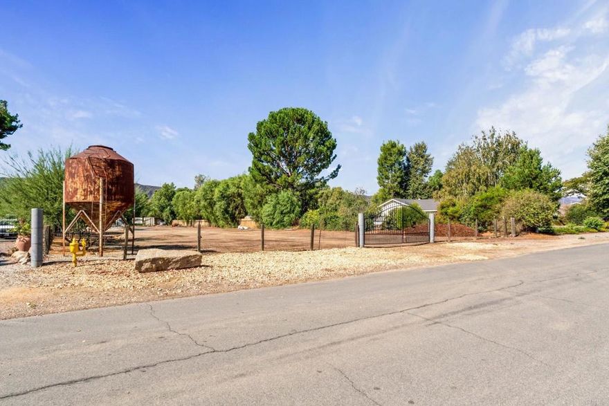 Imagine a place where your custom home sits on a full acre, designed exactly to your taste, with a backyard oasis, and even a guesthouse for family and friends. This isn't just a fantasy; it's a reality waiting for you. This exceptional, flat 1-acre lot is located in one of Murrieta's most sought-after neighborhoods. It's the perfect canvas for designing the house you've always envisioned, complete with a long, tree-lined driveway, a sprawling backyard with a pool, a built-in BBQ, and a cozy fire pit—and still have plenty of room to spare. Situated just south of Murrieta Valley High School and a quick five-minute drive north of Old Town Murrieta, the location provides both seclusion and convenience. Enjoy easy access to local events and a quick commute with nearby freeway access. All essential utilities are already available at the street. This lot has everything you need to bring your vision to life: location, buildability, and convenience. Come by today to start planning your dream.