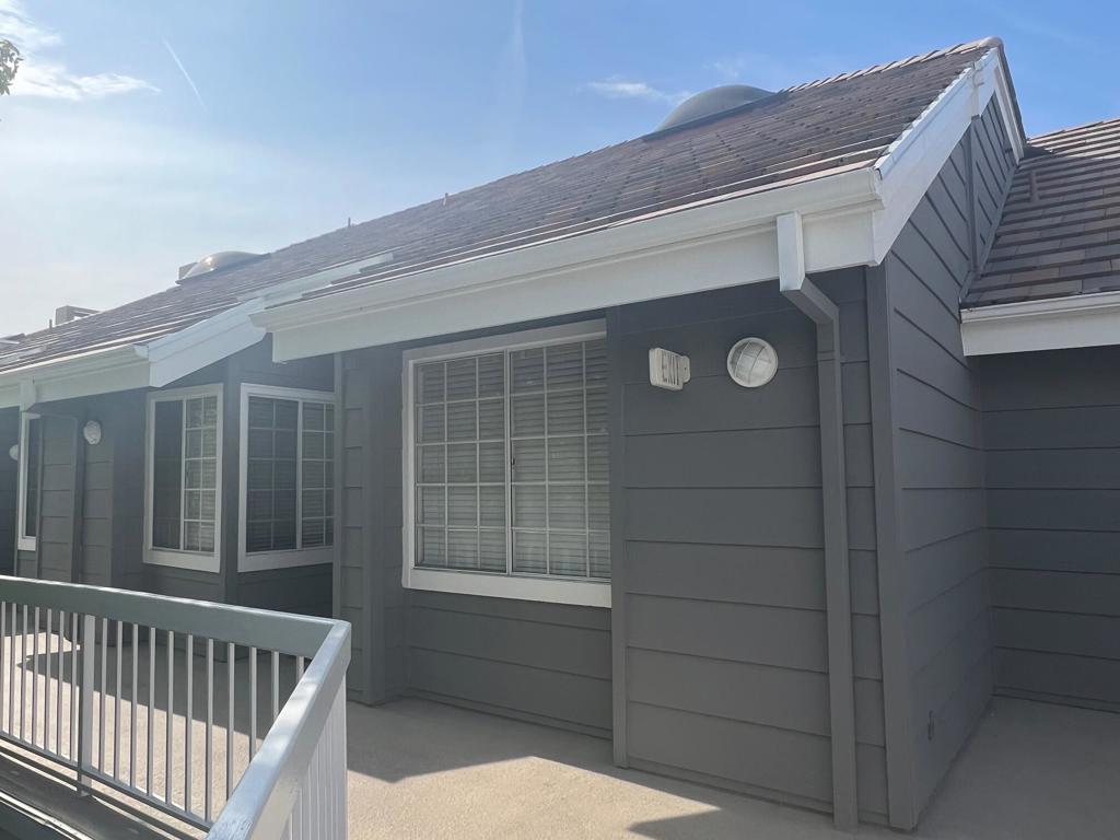 Located in the heart of Huntington Beach, this prestigious Seabridge Villas penthouse sits just one mile from the ocean. Minutes from downtown Huntington, the Pacific City Mall's upscale dining and retail, the Huntington pier, and nearby Newport Beach, Costa Mesa, and Pacific Coast Highway, this location offers unparalleled access to Southern California's coastal lifestyle.This is the largest floor plan in the Seabridge Villa Community and provides a top-floor penthouse offering resort-style coastal living, combining elegance and comfort. The residence features vaulted ceilings and an open-concept design that maximizes both space and natural light through sliding glass doors and large windows that let in the coastal breeze.The main floor includes 2 primary bedroom suites and 2 beautifully renovated bathrooms while the second floor contains a 3rd bedroom and loft for use as an office, workout area or 4th bedroom. The flowing living/dining area includes a fireplace, creating an ideal space for both relaxation and entertaining. The kitchen has been substantially expanded and completely redesigned, featuring modern quartz countertops and brand-new cabinetry. The living room and main bedroom open onto an outdoor patio with private above-ground views of the central landscaped courtyard, swimming pool and waterscape amenities. An open spiral staircase with newly replaced wooden steps leads to the upper level.Convenience features include an in-unit laundry closet with stacked washer/dryer, patio storage closet and coat closet. The underground parking garage provides 2 assigned parking spaces, secured bicycle storage and multiple guest parking spaces. The HOA fee covers essential utilities including water, trash, and natural gas service as well as landscape/exterior building maintenance.Seabridge Villas residents enjoy resort-style amenities including 24-hour guard-gated security with parking patrol, elevator access to all floors, two pools, two spas, a fully-equipped fitness center and a sauna, four lighted tennis courts, and a clubhouse w/full kitchen available for reservation. The grounds are characterized by lush, well maintained, landscaping with an interconnected system of walking paths that follow picturesque ponds, waterfalls and streams.Whether you make this your primary home, vacation home, or see it as a great investment opportunity, this desirable penthouse delivers the best in coastal California living. Don't miss this opportunity