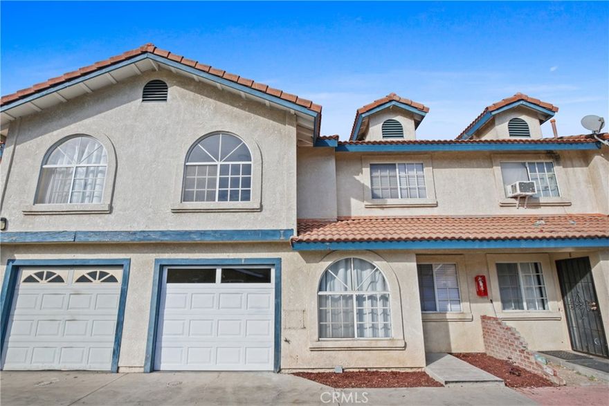 Beautifully updated and move-in ready, this 3-bedroom, 2.5-bath two-story condo is located in a community of just 9 units. The first floor features an open living and dining area, a remodeled galley-style kitchen with white shaker cabinets, quartz countertops, tile backsplash, and stainless steel appliances including a gas range and dishwasher. A convenient downstairs powder room adds functionality. Upstairs, the spacious primary suite includes a walk-in closet, while the two secondary bedrooms offer mirrored wardrobe doors. Both upstairs bathrooms have been fully renovated with new white shaker vanities, quartz countertops, new tubs, tiled shower surrounds, glass enclosures, and updated plumbing fixtures. Additional upgrades include SPC flooring throughout, fresh interior paint, new baseboards, a smart thermostat, and a new water heater. The private patio features decorative tile flooring, and laundry hookups are located in the attached one-car garage. A second parking space is included in a detached garage. HOA dues cover water and trash.