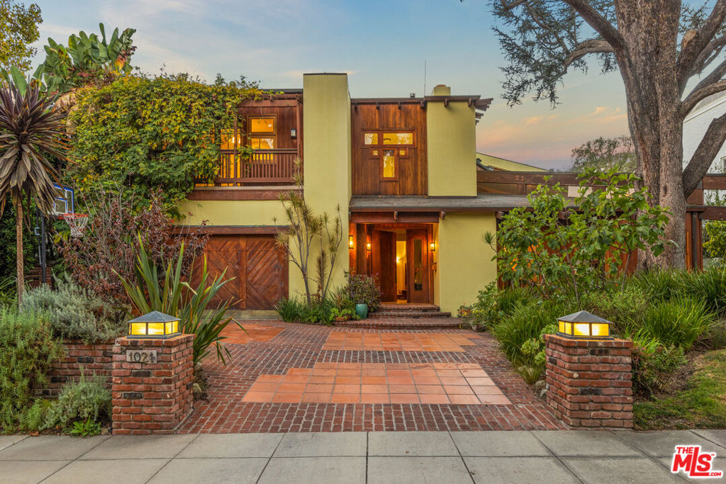 This modern craftsman architectural gem is located in one of Beverly Hills' most iconic streets, behind The Beverly Hills Hotel. With 5 beds, 7 baths and abundant character, this spacious and bright home creates the ideal setting for a family. Its high ceilings and spacious living spaces create a peaceful and serene environment that spills over into the charming backyard filled with beautiful mature trees. The primary suite on the second level with a balcony facing the backyard is accompanied by three other guest bedrooms, each with their own balcony. A bright chef's kitchen faces the sunlit backyard and is next to a comfortable office and maid's quarters. The full-sized basement is unique with its high ceilings and french doors, creating a spacious and airy private space for entertaining. This unique property is situated just a few miles away from world renowned dining and shopping in Beverly Hills.