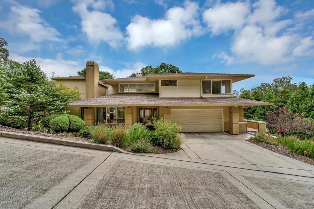 This architectural masterpiece was inspired by Frank Lloyd Wright and designed by local favorite and award-winning, Fred Lattanzio. The house features a modern layout with massive windows and skylights. There are beautiful views of trees and the grounds from every room. Spacious home with 3 bedrooms, 2.5 bathrooms, and 2,402 sq. ft. of living space. This stunning home is situated on 2.5 acres, in a beautiful, gated neighborhood. The home blends indoor luxury with nature, offering elegance in a country lifestyle. The back doors open to a tranquil, park-like setting with wooden decks and tiled patios. With its open floor plan, and ample outdoor living areas, it's perfect for entertaining guests in style. The huge yard features beautifully landscaped gardens with native drought-tolerant plants, creating a sustainable and low-maintenance outdoor space. There is plenty of room to add raised beds. Youll love the end-of-the-road privacy and benefit of neighbors not too far away. This property is perfect if you love modern architecture and the outdoors. And it's conveniently located between Watsonville and San Juan Bautista. It's a short drive to the beach; Monterey, Santa Cruz, and Hollister are about 35 minutes away.