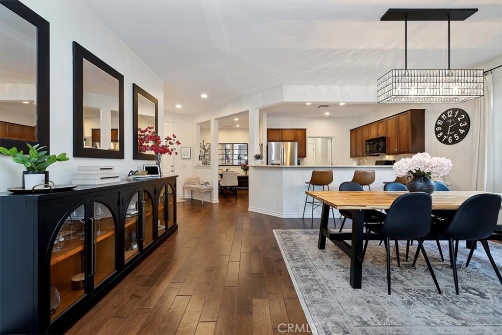 Immaculate, former Model Home | $50K+ in Upgrades | Low-Maintenance Luxury Living. 
Welcome to this beautifully maintained La Jolla floor plan in West Hemet’s desirable 55+ Solera Diamond Valley by Del Webb community. This former model home blends resort-style amenities with everyday ease — freshly painted within the last two years, newer carpet, and full of thoughtful upgrades throughout. Step inside to discover rich hardwood flooring, tall ceilings, and a bright, open layout that seamlessly connects the kitchen, dining, and living areas. The chef’s kitchen features walnut cabinetry, Corian countertops, upgraded appliances, and a breakfast bar — perfect for morning coffee or evening conversation. 
The home’s split-bedroom design offers privacy and natural light throughout. The primary suite includes dual sinks, a spacious walk-in closet + linen closet, newer carpet, and an upgraded ceiling fan. The bright den/office also features a new ceiling fan and is spacious enough to be converted into a third bedroom if desired. Outside, enjoy your low-maintenance backyard retreat with an Alumawood patio cover, remote-controlled market lights, a built-in gas BBQ island, and beautiful, low-maintenance artificial turf — ideal for quiet evenings or entertaining friends. 
Additional features include: heavy-duty front security screen door, built-in ceiling surround-sound system, Ring Doorbell + Wyze-enabled garage door opener, two TV mounts, two patio rugs, all curtains, rods, and blinds + washer, dryer, and (the black) refrigerator, as well as garage cabinetry and storage racks!!!
Residents of Solera Diamond Valley enjoy access to the 23,000 sq. ft. Mountain View Lodge, featuring indoor and outdoor pools, spas, a state-of-the-art fitness center, aerobics/Pilates studio, tennis, Pickleball, and bocce ball courts, an indoor walking track, billiards, ballroom, and library. The community also offers craft and hobby rooms, a coffee bar, a computer lab, and a vibrant calendar of social events. This immaculate former model home combines comfort, connection, and the best of the Southern California lifestyle in a premier active-adult community. Come view this one-of-a-kind home before it’s too late!