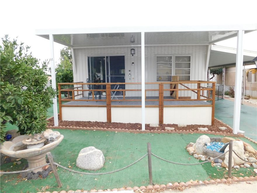 ~Immaculate home located in Yucaipa’s highly desirable 55+ community, Carriage Trade Manor! Low space rent! Only $412!~Conveniently located across the street from clubhouse and pool!~Pride of ownership shows throughout with recent upgrades including, new tankless water heater in May 2025, new carpeting throughout in June 2025, freshly painted interior AND exterior in September 2025, new blinds, light fixtures, light switch cover plates, ceiling trim, and baseboards throughout in 2025, new front porch awning in February 2025 by Merriman’s, new central heating ductwork and registers in 2023, new window/wall AC units, and swamp cooler upgraded with new float, base, and cleaned in 2025!~Coming in through the front sliding glass doors, you’ll find a welcoming and bright living area, open to dining area, with built-in china hutch!~Kitchen has all new counter tops done in 2025, newly painted cabinets, fixtures, and new hinges in 2025, new flooring, stainless steel sink, garbage disposal, fridge included, pantry, and range with exhaust fan!~HUGE primary bedroom with AC unit and plenty of built-in closet space that’s freshly painted with all new fixtures!~Completely remodeled and extended bathroom with new shower/tub, new shower head and fixtures, new toilet seat and cover, new flooring, painted and drywalled, new vanity and faucet, and gorgeous new light fixture above vanity!~Queen size 2nd bedroom, located directly across from bathroom, with plenty of closet space!~Home is plumbed for a second bathroom as well!~Laundry hookups located conveniently outside carport door in shed, washer/dryer included!~Meticulously maintained yard with lemon tree, 5 grape plants, white nectarine tree, yellow delicious apple tree, pink grapefruit tree, and dwarf satsuma mandarin orange tree!~New artificial grass in front and side yards!~Extra shed in perfect sized back/side yard!~2 car carport!~Beautiful mountain views from front porch!~Already fenced/gated for pets!***Call for a tour today before it’s gone!! You will DEFINITELY be impressed!!***
