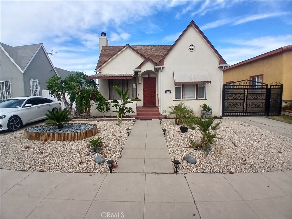 PRICE REDUCTION!! This charming Spanish-style home features a remodeled 2-bedroom, 1-bathroom. Standalone garage possibly suitable for an ADU! Cozy living room that includes a fireplace and a large, picturesque window to enjoy the view of the beautifully landscaped low-maintenance front yard with lush trees. The upgraded bathroom offers a spacious shower, safety bars, and a 36-inch entry door for handicapped accessibility. The kitchen is equipped with granite countertops, a graphite stone sink, and stainless-steel appliances, including a newer stove/oven, LG refrigerator, and stackable washer/dryer combo and are all included in the purchase price. Upgraded remote controlled ceiling fans throughout, updated plumbing, iron security gates, a tankless electric water heater, features new 3-inch blinds for window coverings and newer cabinetry throughout, adding to its modern charm. and. It also has stunning marble-tiled floors and French doors that lead out to a raised deck patio ideal for entertaining, complete with a propane BBQ/Grilling station with island. The backyard offers an open canvas, including a finished garage with shelving, allowing you to design and style the space to your liking... The home is located in a warm, family-friendly neighborhood, close to schools, making it ideal for a variety of lifestyles. With everything move-in ready, this property is a must-see for anyone serious about home-ownership—don’t miss the chance to make it your own!