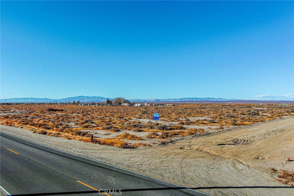 First time on the market in decades and decades. Large lot right on the corner of E. Ave E & 97th St E on a long paved road. Perfect corner lot to build your dream home, ranch or farm. So many possibilities for this beautiful piece of desert land. Beautiful views of the surrounding mountains and hills. Come see it while it is still available. This property is priced right and not expected to last long on the market. This is a must see property, hurry before it's too late!