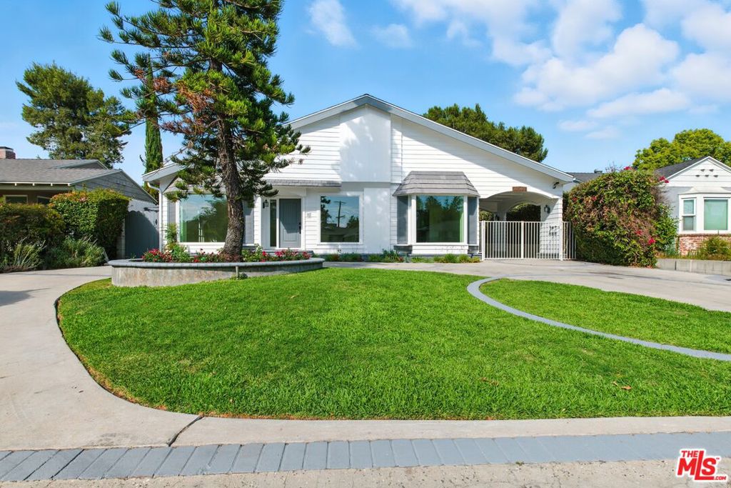 Discover this rare opportunity to lease a fully remodeled 5-bedroom, 4-bathroom residence offering over 4,300 sq. ft. of living space in the heart of Studio City. Combining classic charm with modern upgrades, this expansive home delivers versatility, elegance, and comfort on a grand scale.A half-moon front driveway framed by mature landscaping sets a welcoming tone, while gated entry and additional covered parking ensure both convenience and privacy. Step inside to soaring ceilings, a cascading staircase, wide bay windows, and light-filled rooms that create an inviting yet sophisticated atmosphere.The fully renovated interior features a seamless blend of timeless finishes and contemporary updates. The living and dining areas flow effortlessly, complemented by a chef-inspired kitchen with quartz countertops, sleek cabinetry, and modern fixtures perfect for everyday living and entertaining.Upstairs, the spacious bedrooms include a serene primary suite with a walk-in closet and spa-style bathroom. Additional baths have been stylishly redesigned with subway-tile showers, designer vanities, and updated hardware. A sprawling finished loft level provides endless options as a media lounge, game room, gym, or creative studio.The property also features a flexible ADU-style space ideal for a private office or guest quarters, ensuring plenty of room for today's lifestyle needs.Step outdoors to your resort-style backyard with a sparkling pool, spa, and stone patio, designed for California living at its finest.Perfectly located in a quiet neighborhood yet just minutes from Ventura Blvd, Tujunga Village, shops, dining, and freeway access, this home combines space, style, and convenience like no other!