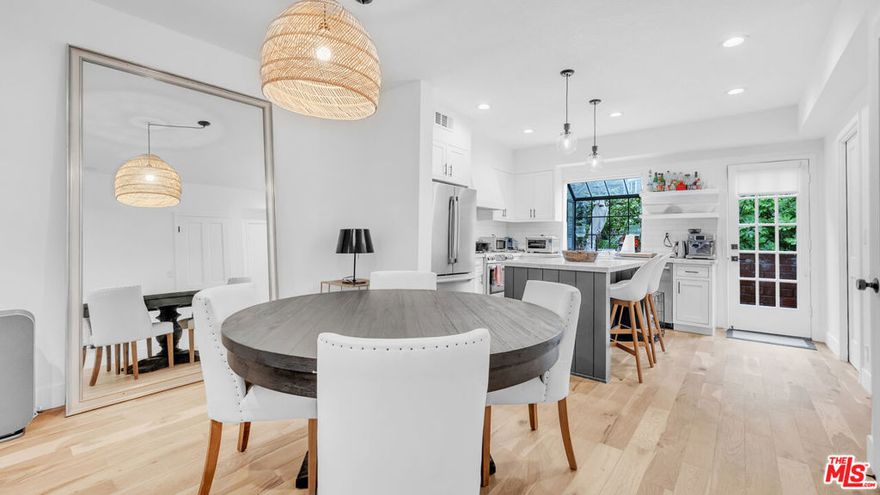 Just off Ocean Avenue, this Santa Monica townhome puts you a half block from Palisades Park and the bluffs. Spanning three levels with its own interior elevator and roughly 1,577 square feet, the layout is both functional and inviting. The remodeled kitchen opens to a private patio ideal for coffee in the morning or dinner outdoors. The living room gets great natural light and centers on a wood burning fireplace. Upstairs you'll find a bright guest bedroom with full bath, laundry, and a den or office. The top floor is dedicated to the primary suite with vaulted ceilings, a walk in closet, private terrace, and a bath with double vanity, soaking tub, and glass shower. Oak floors, central air, and two side by side parking spaces with storage add to the comfort. San Vicente Ocean Townhomes is a small gated community built in 1982, tucked into a quiet setting with open space to the east, yet steps to Montana and the beach. Clean, easy, and ready.