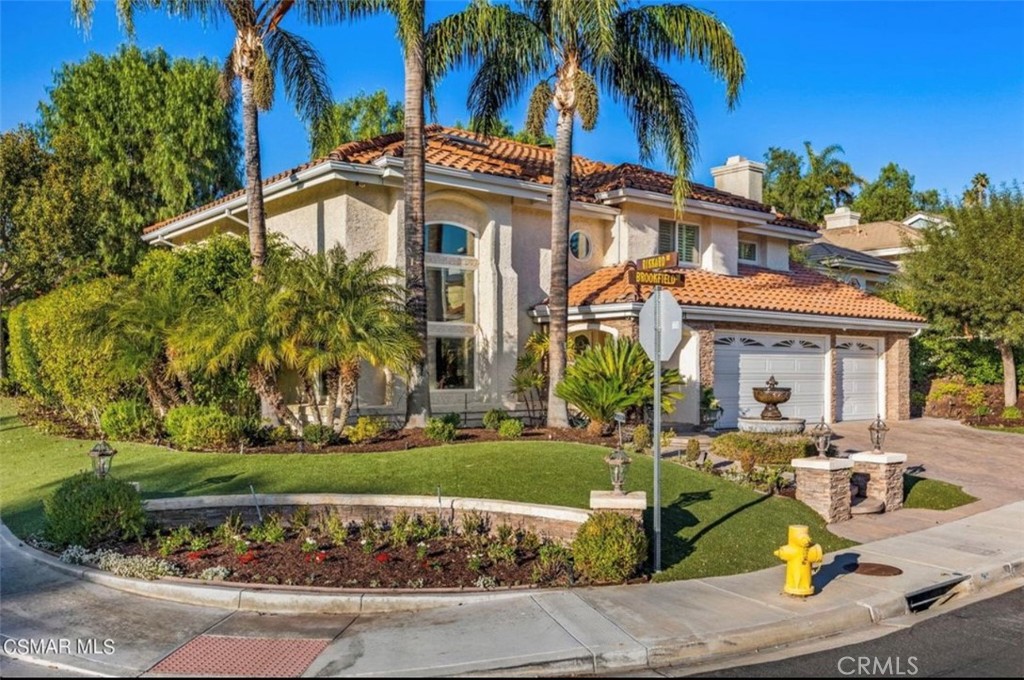 Welcome to 2001 Brookfield Drive—a beautifully updated 4-bed, 3-bath home on a desirable corner lot in The Braemar neighborhood of Thousand Oaks.
This serene property features lush landscaping, mature trees, a sparkling pebble-tech pool/spa, built-in BBQ with outdoor fridge, and a tranquil koi pond with a lighted waterfall. A new bi-fold patio door creates seamless indoor/outdoor living.
Inside, soaring ceilings and mahogany floors set an elegant tone. The open kitchen boasts European-style cabinetry, marble porcelain tile, and new lighting, while the bathrooms have been stylishly updated. Upgraded Milgard windows, QuietCool fans, and a recently updated A/C system ensure year-round comfort.
Impeccably maintained and move-in ready, this Thousand Oaks retreat combines modern upgrades with peaceful hillside living.