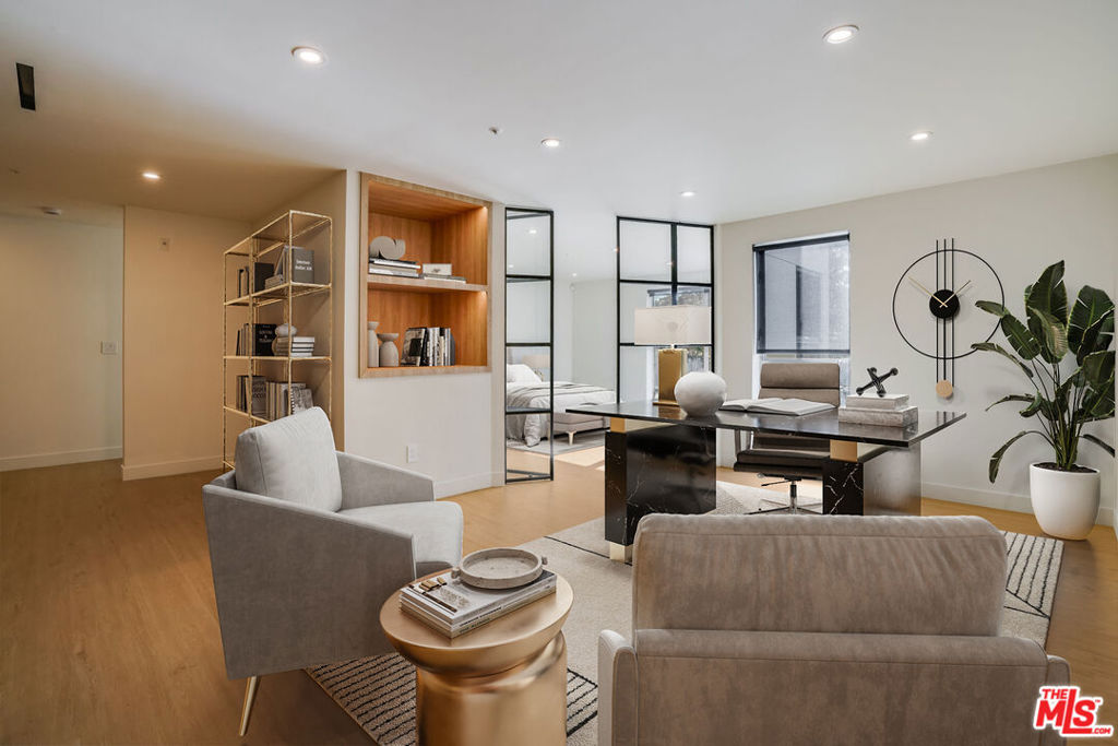 This sleek and stylish, quintessential live-work style apartment located in the heart of Santa Monica in Silicon Beach is centrally located to cafes, restaurants, shops and more. The spacious 2-story apartment feels more like a home than apartment. Enjoy all the luxuries and comforts in this meticulously transformed space with top of the line finishes throughout. The unit is private, and has a cozy outdoor patio sitting area. You enter upon a large living area with a modern fireplace, mounted flatscreen TV flanked by large picture windows. The spacious dining area can also be used for an office or additional seating area. The modern and remodeled chef's kitchen features a high-end Smeg refrigerator, and Smeg stove perfect for cooking up large dinners or just looking good. Plenty of storage in the custom 3-pantry system and oak shelving. The kitchen has space for a breakfast table or more. The downstairs features a stunning bathroom with matte black tiles accentuated by the oak vanity and cabinet. Beautiful light colored wood-like floors and recessed lights can be seen throughout the space. Up the stairs, you will find plenty of storage in the modern custom closet system as well as an open area perfect for a workstation or sitting area. The gorgeous master bath features a tub/shower and floating vanity with a large round mirror. The large primary bedroom is accessed through sleek French-style doors just off the open area and has large picture windows with remote control roller shades. Privacy is not an issue here with remote control window treatments throughout the apartment home. Washer/dryer in unit & 1 parking space in the private & gated garage. A must see whether you are looking for a stylish apartment or a live-work office space. Easy to show.