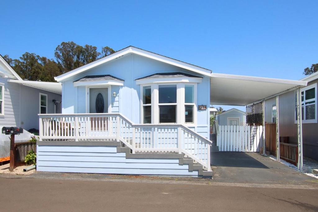 HUGE PRICE REDUCTION !! If you are looking to downsize to a bright, light, clean, contemporary home in one of the nicest and friendliest parks in mid county, this is it ! Rodeo Mobile Estates (55+) in Soquel is centrally located near 41st Avenue shopping, two hospitals, and direct bus service to downtown Santa Cruz. Situated on a quiet street in the park, this two bedroom, two bath home is in like-new condition, and just waiting for you. Built in 2004, and completely renovated in 2017, this beautiful home has a front porch, parking for two cars, and a patio at the rear. There are two sheds, one for tools and a larger one with electricity for workshop or storage. The interior of this quality home is filled with light from numerous windows and skylights, features wood laminate flooring throughout (carpet in bedrooms), and a separate laundry room with washer and dryer. There is a separate area in the park for your RV if you have one. Life is good here. Meander over to the clubhouse for morning coffee with friends, or perhaps take a dip in the pool in the afternoon.
