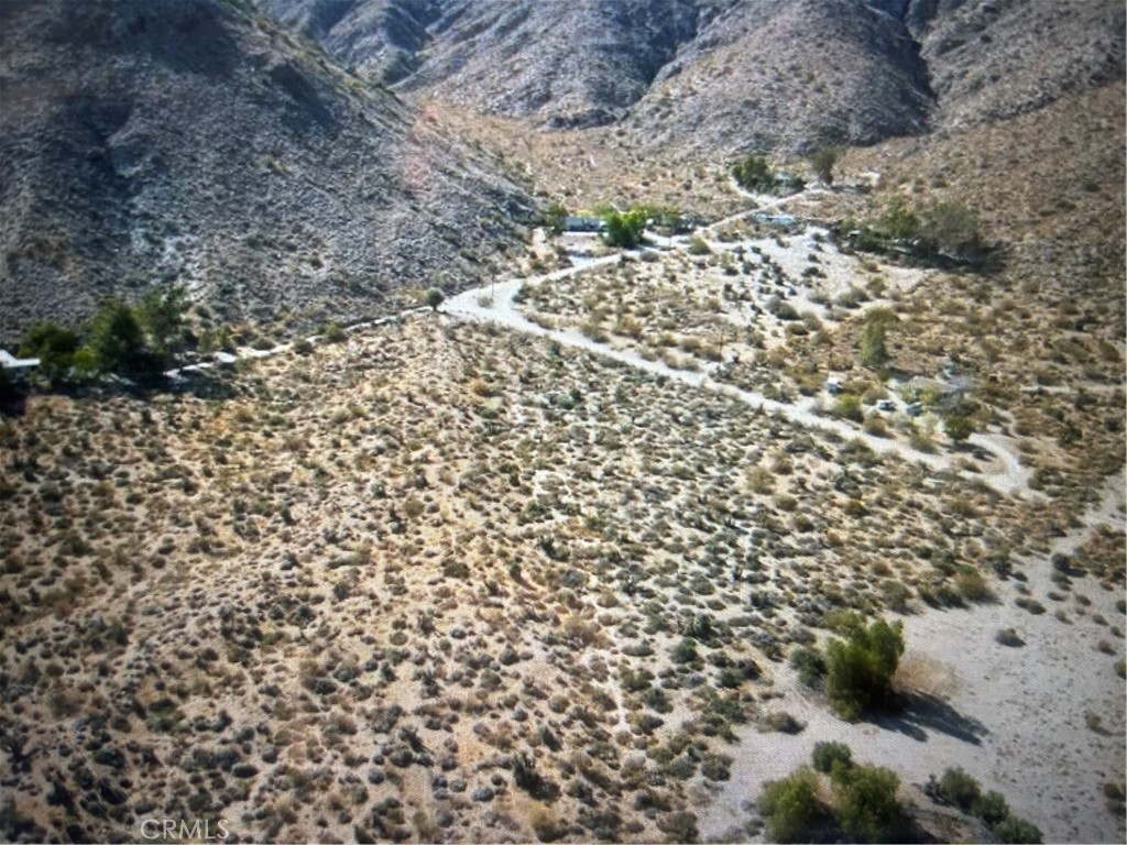 3 Bedroom 2 bath Manufactured Home on 5 Acres of Land come own your own piece of the desert. The land has its own well 360 foot deep well with a gravity feed and holds up to 2500 gallons of water. The land set up for you to add a New House or more manufactured Homes. Plenty of space.