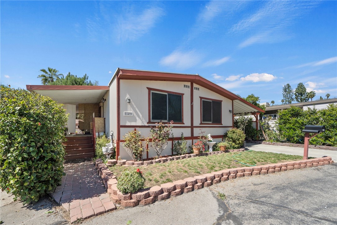 Welcome to your new home! This beautifully updated 3-bedroom, 2-bathroom manufactured home is tucked away on a peaceful cul-de-sac within the highly sought-after Rancho Caballero Mobile Home Park. Inside, you'll find a spacious and modern floor plan, featuring luxurious vinyl flooring, textured walls, and crown molding throughout. The entire home, inside and out, has been freshly painted, creating a bright and welcoming atmosphere. The kitchen and bathrooms have been thoughtfully remodeled, and the two large walk-in closets provide ample storage. Additional modern upgrades include dual-pane windows for energy efficiency and an updated electrical system. Living here means enjoying fantastic community amenities, including a swimming pool, tennis courts, a dog park, and a clubhouse—all within a scenic, country-club-like setting. Ready to see it for yourself? Schedule a showing today and discover the best of Riverside County living!