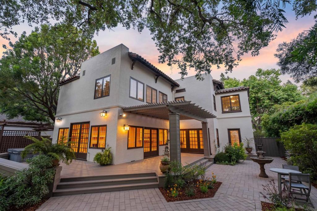 Comprehensively updated for your move-in ready enjoyment! Discover 631 Coleridge: a charming Spanish-style home on Old Palo Alto's most prestigious street. This expansive 10,649 sq ft lot with mature trees is on a peaceful cul-de-sac, free from thru traffic. Inside, enjoy hardwood floors, 9-foot ceilings, and beautiful wavy glass windows. The cozy living room features a wood-burning fireplace, and the bright office and dining room offer stunning views. The entirely renovated kitchen boasts a wraparound peninsula, bar seating, custom cabinetry, and brand new appliances. The upper level includes a luxurious primary suite, three spacious bedrooms, two additional bathrooms, and a flexible sunroom. Outside, relax on the wraparound deck, pergola dining area, or in the hot tub under the majestic Oak tree. The private backyard includes a carriage house with a kitchenette and full bath, ideal for an office or guest space. Don't miss this rare opportunity! Easy access to downtown Palo Alto shops and restaurants, Stanford University, Silicon Valley employers, and award-winning Palo Alto schools. Visit today and experience the best of Old Palo Alto living.