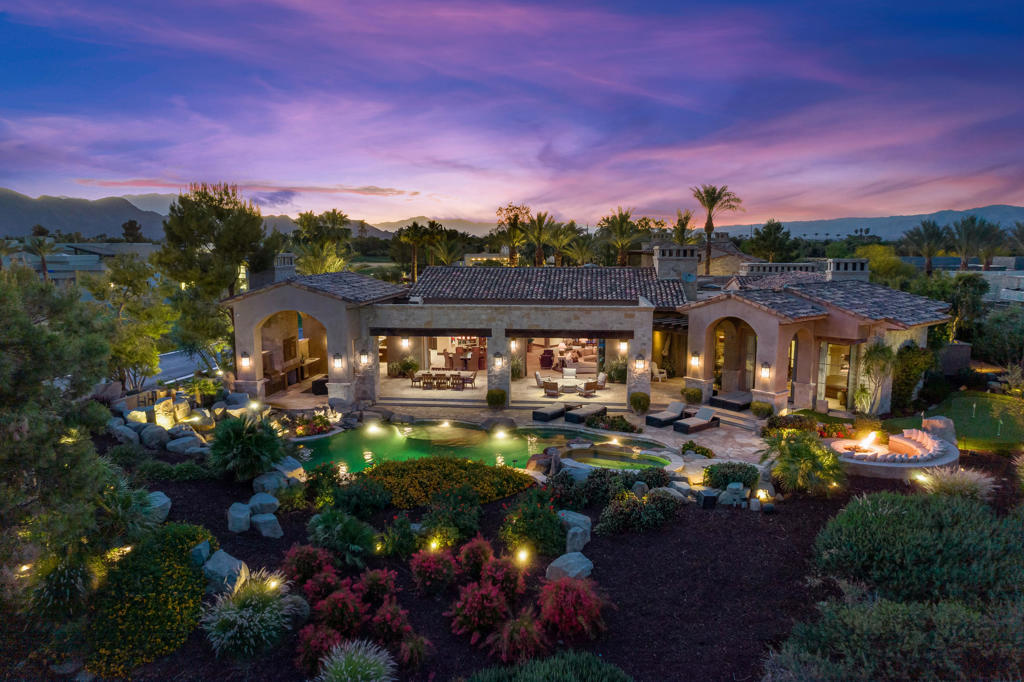Stunning South facing estate by Lance Fedderly at the Madison Club! Five bedrooms, five and a half baths including a separate two bedroom guest house plus office. Approx. 8,299 sq. ft. on .86 acre lot. Featuring a beautiful rotunda entry to great room with fireplace, media, dining, custom wet bar with adjacent wine room. Gourmet kitchen with center island / counter bar, top of the line appliances and breakfast nook. Amazing home theatre with ample seating and built-ins. Handsome office / library with gorgeous wood finishes and built-ins. Large master retreat boasts dual fireplace to sitting room and spa inspired his and her bath with double glass shower, fireplace over jetted tub and tranquil private outdoor patio. All guest accommodations are ensuite with walk-in closets. The detached guest house is complete with fireplace, mini kitchen and a second bedroom which is now a game room with wet bar and balcony patio with fireplace. Motorized pocket doors open to an awesome outdoor living area with fireplace, media, dining, BBQ center and wet bar. Custom rock waterfall pool and raised waterfall spa, firepit with custom seating area and putting green. Every amenity plus incredible South facing mountain, lake and golf course views on the 2nd hole of the Tom Fazio Course. Offered furnished per inventory! Madison membership must be purchase separately.