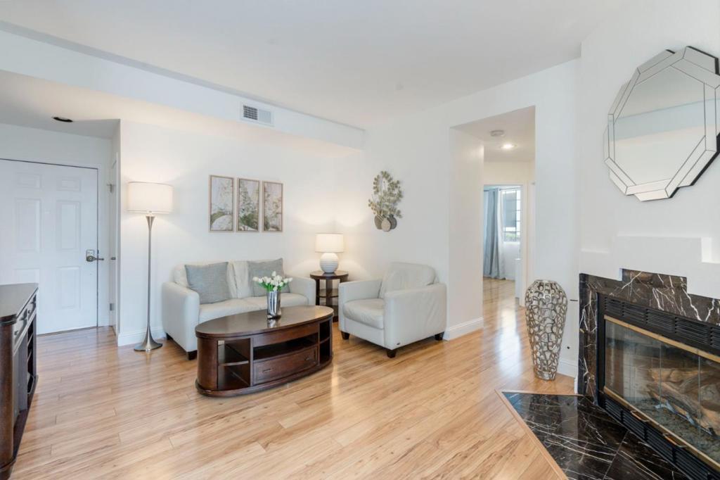 Beautifully Updated Ground-Floor End Unit in Prime Location!2BD/2BA | Designer Upgrades | Attached Garage with TV & Speakers | Two Private Patios Welcome to this stylish and serene ground-floor end unit featuring a neutral interior palette, cozy fireplace, and designer finishes throughout. This thoughtfully designed home offers two spacious bedrooms, two full bathrooms, and an attached garage equipped with a TV and built-in speakersperfect for relaxing or entertaining. Enjoy indoor-outdoor living with two private patios surrounded by lush, HOA-maintained landscaping and tranquil mature redwoods. Located within walking distance to shopping and dining, with easy access to I-580, I-680, and BARTideal for commuters. Nearby attractions include the San Francisco Premium Outlets and a variety of restaurants and shops. HOA covers water, sewer, trash removal, and property insurance.Don't miss this move-in-ready gem in a highly desirable location!