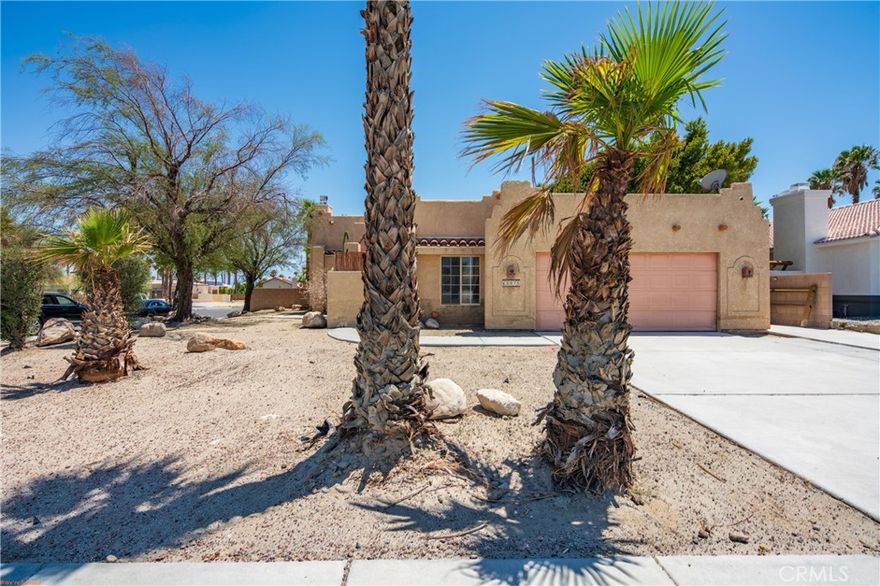Charming Spanish-style Pool  home situated on a desirable corner lot in the picturesque Panorama neighborhood on a large flat land over 9.000 SQ FT. Conveniently located near shopping, dining, golf courses, parks, hiking trails, and popular local attractions. Step inside to a open floorplan featuring high/vaulted  ceilings, a cozy fireplace, and a beautifully upgraded modern kitchen and living area. Enjoy indoor-outdoor living with access to a private courtyard, complete with a stunning pool and low-maintenance desert landscaping. A 12-foot sliding gate on the side of the property allows for RV or oversized vehicle parking. Additional highlights include a tankless water heater and smart home features controlling the pool system, HVAC, door locks, and garage.