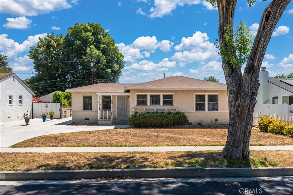 Located on a charming tree-lined street in the highly sought-after Lake Balboa neighborhood, this 3-bedroom, 1-bath home offers an incredible opportunity with fully approved plans for a 2-bedroom, 2-bath ADU. Inside, you'll find original hardwood floors, dual-pane windows, central HVAC, and an indoor laundry room. A large, enclosed rear patio adds extra versatile space to spread out and entertain. The spacious backyard features a detached two-car garage, already approved for conversion into a 750 sq ft ADU — ideal for multi-generational living or rental income. There’s also a mature lemon tree, plenty of room to add a pool, and endless possibilities for outdoor entertaining. Conveniently located near the 101 & 405 freeways, with easy access to dining, shopping, schools, parks, and public transit. Don’t miss this rare opportunity to customize and add value in one of the Valley’s most desirable communities!