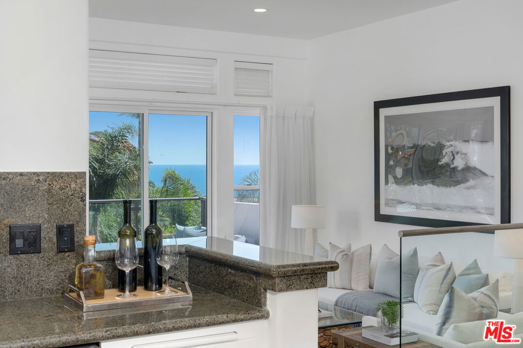 Enjoy stunning ocean views every time you come home! Look out past the greenery of the garden to the sea beyond and your soul will be soothed. Enjoy all the attributes of this newly spruced up townhouse in the upscale community of Vista Pacifica at Broad Beach. The townhome boasts high ceilings, an open floor plan, and the spacious feeling that everyone wants. Stone and wood flooring throughout, there's a fireplace in the living room and in the primary bedroom. There are two ocean view decks on both floors, vaulted ceilings, a marvelous walk-in closet and both bedrooms' bathrooms have a separate tub and shower. The community offers a pool, an exercise room and gated access. Close to restaurants, markets and beautiful beaches - This fabulous townhouse awaits!