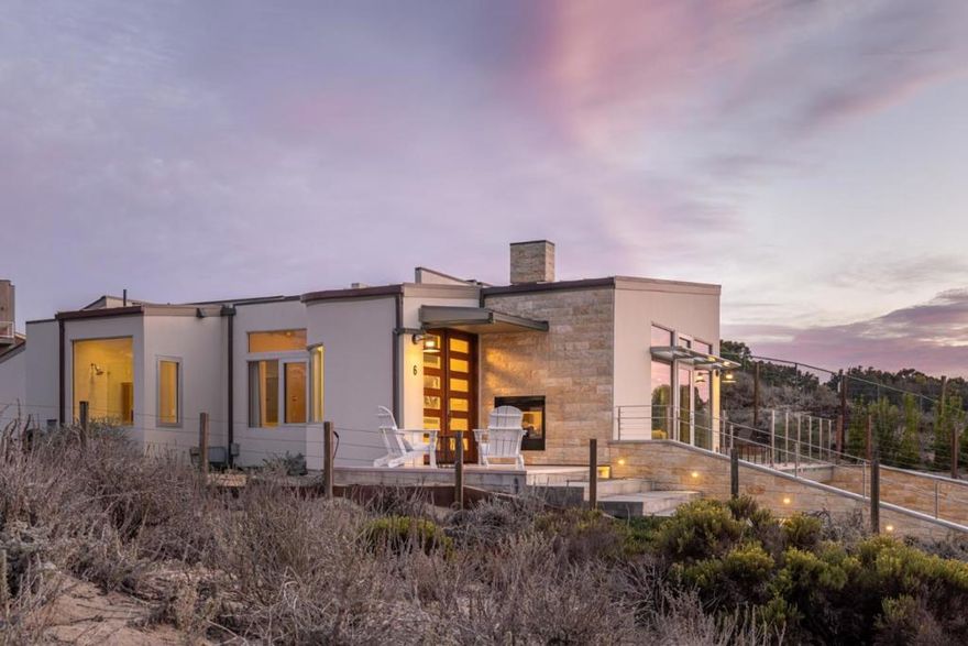 Tucked in Montereys coveted coastal community, 6 Spray offers stylish, beachside living just minutes from Cannery Row and the Monterey Bay Aquarium. Built in 2017 on Del Monte Beach, this contemporary home features breathtaking ocean views, an open-concept layout, and refined architectural details like curved walls, sleek railings, and expansive glass. Designed for single-level living, it includes a rooftop deck with panoramic views and a bonus room off the two-car garage. Perfect as a primary home, vacation retreat, or investment, this rare oceanside gem blends modern design with the timeless beauty of the Pacific.