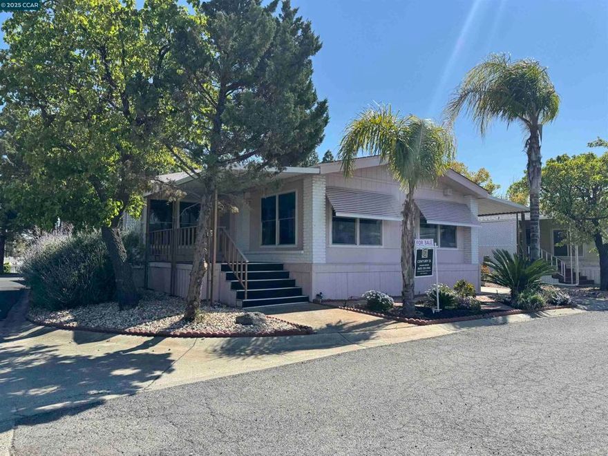 Don't miss out on this charming home in highly sought-after Delta Hawaii 55+ neighborhood! As you arrive to this corner-lot property, you will be greeted with a beautifully landscaped front-yard. Upon walking through the front door, you will be welcomed with a spacious front room with original wood paneling throughout the home that has a warm and cozy cabin style feel to it that is stunning. This spacious house features 2 bedrooms / 2 bathrooms and features a charming family room with a fireplace that adds warmth and character to the living space. This residence will include: Brand new air conditioning and heating unit, brand new carpeting, two-year-old water heater, washer, dryer, refrigerator, built-in oven and microwave, electric cooktop, dishwasher, laundry room, built-in bar, office room, and plenty of cabinet space. This home offers a relaxing front and backyard porch that's perfect for BBQs and an outside shed for storage. The Delta Hawaii community hosts many activities throughout the year. The newly renovated clubhouse offers a pool, hot tub, gym, kitchen and more. Make this charming home your forever home and enjoy the lively community of Delta Hawaii. Now is the time to buy this spacious triple wide! If interested, contact the listing agent, Carlene at 925-330-3140.