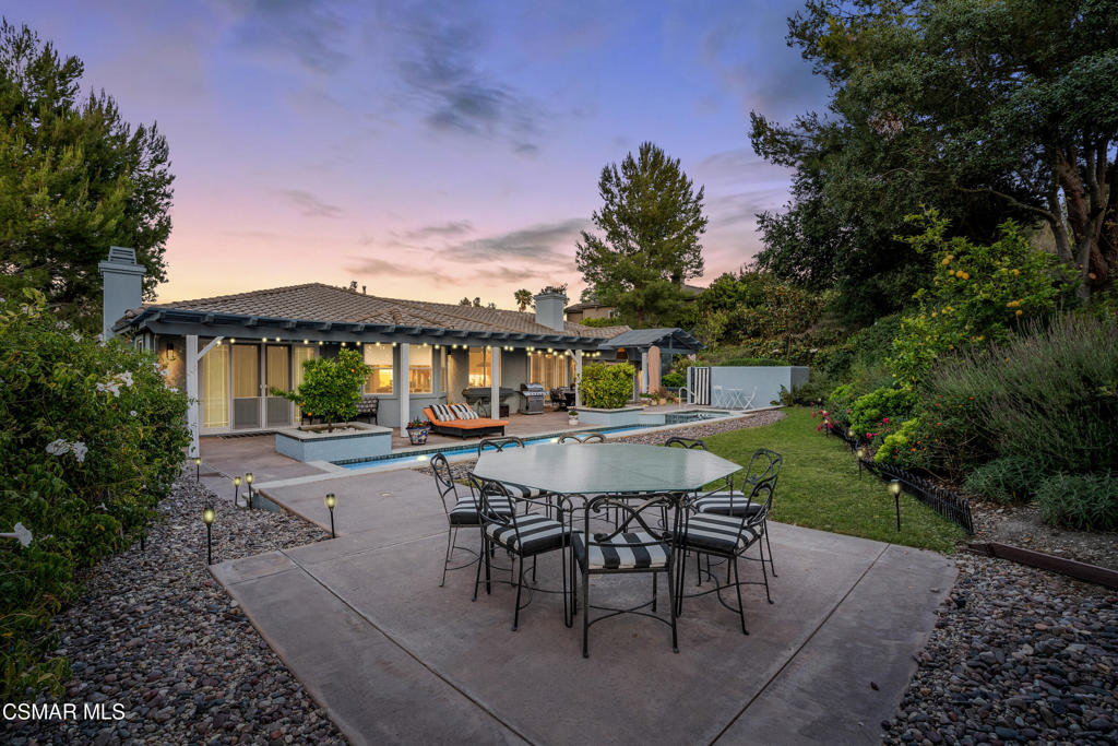 Tucked behind a private gate on an exclusive cul-de-sac of just ten residences, this luxurioussingle-story pool home is a rare offering in one of the Conejo Valley's most desirable hiddenenclaves. Completely reimagined in 2017, the home blends high-end design, comfort, andsophistication to create an effortless California lifestyle.Step through the grand double-door entry into a light-filled, open-concept floor plan enhanced bysoaring ceilings, premium wide-plank flooring, and seamless indoor-outdoor living. The customchef's kitchen features quartz countertops, top-of-the-line stainless steel appliances, a built-inwine fridge, and an oversized walk-in pantry--perfectly designed for entertaining and everydayluxury.The spacious family room, framed by walls of windows, offers captivating views of the pool andbackyard oasis. The private primary suite is a tranquil retreat with vaulted ceilings, directoutdoor access, and a spa-inspired bathroom with a deep soaking tub, dual teak vanities withambient underlighting, an expansive shower, and two custom walk-in closets.Three additional bedrooms are thoughtfully located on the opposite side of the home--ideal forguests, children, or a dedicated home office. The resort-style backyard is built for relaxation andentertainment, featuring updated landscaping, a sound system, and multiple lounge areasincluding a scenic upper viewing pad perfect for dining al fresco or enjoying the sunset.Additional upgrades include a dual-zone HVAC system, an indoor laundry room, a 3-car garage,and carefully curated modern light fixtures that enhance the home's elevated style.This is more than a home--it's a lifestyle. Properties in this sought-after neighborhood are rarelyavailable, making this a truly exceptional opportunity.