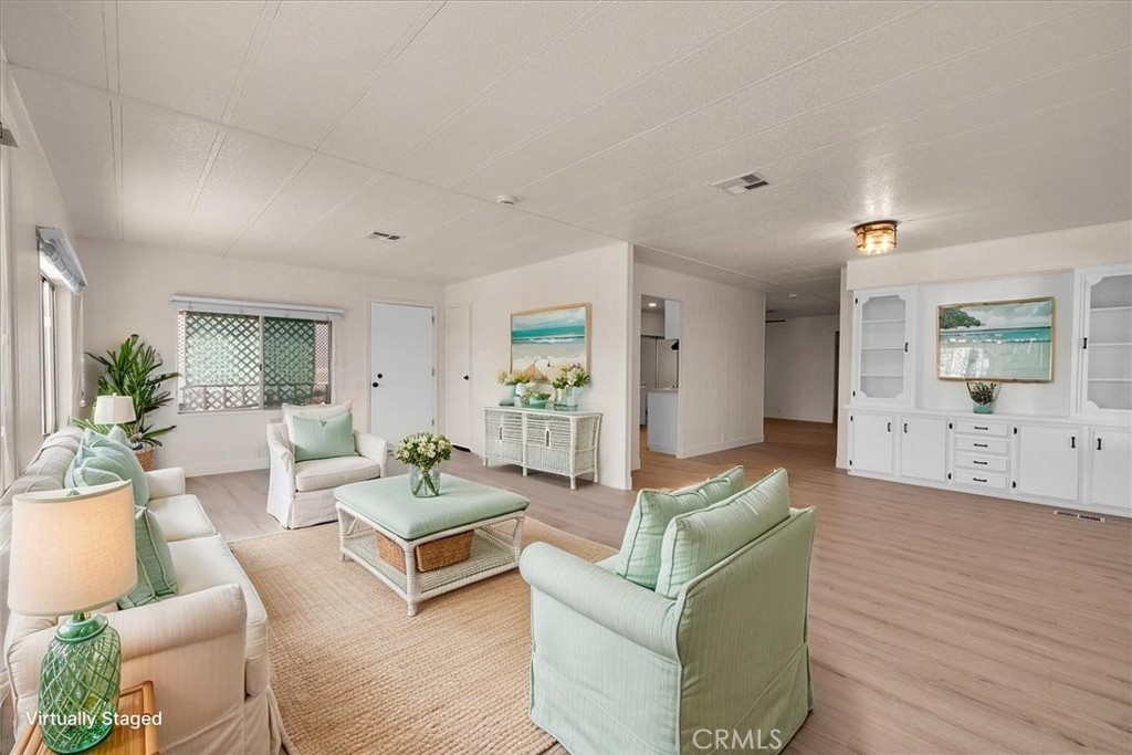 Move in Ready! Seller Willing To Sell On Payments. Discover this beautifully refreshed manufactured home in Aztec Estates, a secure, gated 55+ community in Yucca Valley. Inside, you’ll find very spacious living, dining, and kitchen areas, a big sunroom, and an additional bonus room off the primary bedroom—perfect for a home office, craft room, or reading nook. The bedrooms are generously sized, offering plenty of comfort and flexibility.
Recent updates include brand-new flooring, fresh interior paint, an updated kitchen with stylish new hardware, and modernized bathrooms with contemporary finishes.
Aztec Estates provides a peaceful, welcoming environment with regular community events and social gatherings, fostering a true sense of connection. Ideally located just minutes from shopping, dining, medical services, and Joshua Tree National Park, this turnkey home combines comfort and convenience.
Don’t miss your chance to own in one of Yucca Valley’s most sought-after 55+ communities—with seller financing options available! (Some photos have been virtually staged.)