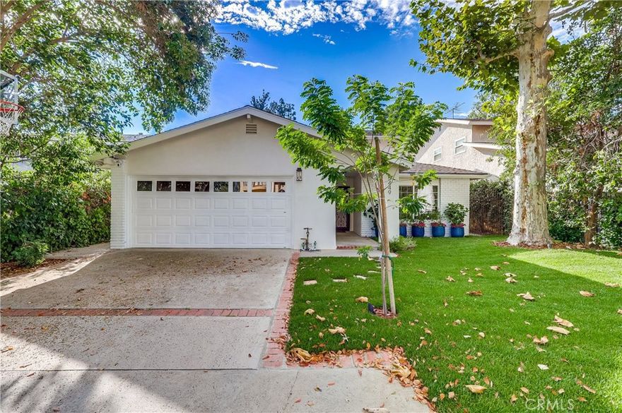 From the moment you walk through the front door of this Modern Spanish home, you’re welcomed by an open and inviting layout with beautiful archways that blends elegance and comfort. This beautifully remodeled 5 bedroom, 3 bath home in the sought-after Chandler Estates area of Sherman Oaks features a stunning updated grand kitchen, new floors throughout and a wonderful backyard. The home offers an open-concept design while maintaining defined spaces for dining and entertaining. The great room, complete with a cozy fireplace, opens directly to the kitchen outfitted with a stunning colbalt blue Viking range and a wall of glass sliders that lead out to the backyard. An attached two-car garage adds convenience and functionality. Upstairs, you’ll find 4 spacious bedrooms, including a large primary suite with abundant closet space and a spa-like bathroom, along with a fantastic balcony that spans across 3 bedrooms including the primary suite. A downstairs bedroom with full bath provides ideal space for guests or a home office. The expansive backyard is designed for every lifestyle, with a covered patio for al fresco dining, an outdoor BBQ island, a sparkling pool and spa, and a grassy play area — all set against lush landscaping. This home offers the perfect blend of thoughtful updates including updated smooth stucco, new grass, great outdoor lighting that can be controlled by your phone and 2 zone surround system all set in a premier Sherman Oaks location.