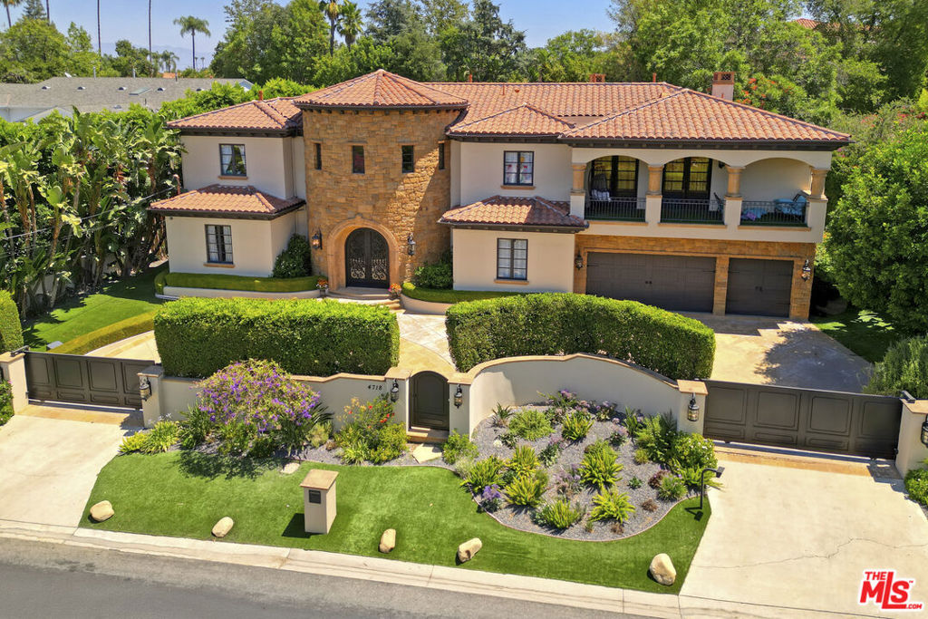 Full property video link below - Experience timeless elegance and refined comfort in this Tuscan-inspired estate, ideally situated south of Ventura Blvd. in prime Encino. Set on a lush, gated property, this residence offers both privacy and serenity while showcasing exceptional scale and craftsmanship throughout. The home features six spacious en-suite bedrooms, complemented by a dedicated office, gym, and two remarkable family spaces: one a sophisticated music lounge, the other a vibrant media or game room complete with bar. The primary suite is a true sanctuary with dual walk-in closets, a spa-like bath, and peaceful balconies that overlook the trees. At the heart of the home, a chef's kitchen with premium appliances and dual islands flows seamlessly into the spacious living room, perfect for both everyday living and large-scale entertaining. The backyard features a resort-like setting with a sparkling swimmers pool, spa, outdoor kitchen, dining terraces, and a cozy fireplace for evening gatherings. Manicured gardens and mature landscaping create a park-like backdrop, while a versatile detached casita serves as a stylish guest or pool house. Additional highlights include a full security and camera system, gated entry, and the option to purchase mostly furnished. This is a rare opportunity with seller financing potentially available.