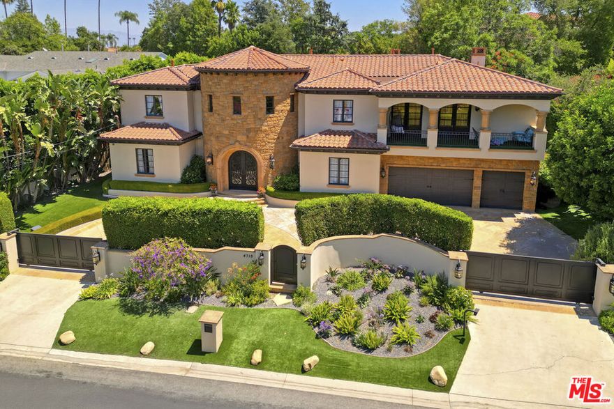 Full property video link below - Experience timeless elegance and refined comfort in this Tuscan-inspired estate, ideally situated south of Ventura Blvd. in prime Encino. Set on a lush, gated property, this residence offers both privacy and serenity while showcasing exceptional scale and craftsmanship throughout. The home features six spacious en-suite bedrooms, complemented by a dedicated office, gym, and two remarkable family spaces: one a sophisticated music lounge, the other a vibrant media or game room complete with bar. The primary suite is a true sanctuary with dual walk-in closets, a spa-like bath, and peaceful balconies that overlook the trees. At the heart of the home, a chef's kitchen with premium appliances and dual islands flows seamlessly into the spacious living room, perfect for both everyday living and large-scale entertaining. The backyard features a resort-like setting with a sparkling swimmers pool, spa, outdoor kitchen, dining terraces, and a cozy fireplace for evening gatherings. Manicured gardens and mature landscaping create a park-like backdrop, while a versatile detached casita serves as a stylish guest or pool house. Additional highlights include a full security and camera system, gated entry, and the option to purchase mostly furnished. This is a rare opportunity with seller financing potentially available.