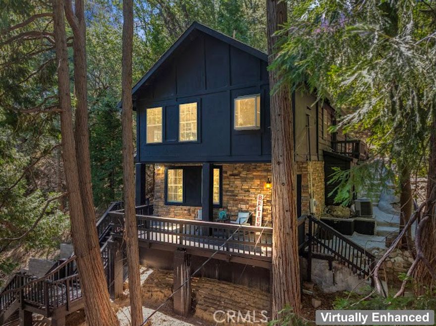 Just three minutes from Lake Gregory, this black cabin rests quietly among tall pines and forest canopy—a peaceful two-bedroom, two-bath retreat on nearly half an acre.  Each season brings its own magic: golden leaves whispering in the fall breeze, fresh snow transforming the land into a winter wonderland, and the first rains awakening the scent of pine and earth.  Deer visit the back field to rest, as if they too feel the calm that lives here. A newly built gazebo offers the perfect space to gather and reconnect, while the spacious front deck—sheltered from the sun—is ideal for morning coffee or soft evening conversations. This home has been lovingly cared for, and it’s ready for its next chapter—with someone who will feel just as at home in its stillness as the current owners did.  



Property boast tranquility with amazing forrest views. Large front wood deck perfect for relaxing, was recently re-enforced.  Mountain living at is best!  Lake during the summer and snow in the winter.  1st level offers a large bedroom with ship lap wood accent wall, and a step down level perfect for a seating area/retreat. Can also be used as a home office.  The upstairs level welcomes you with an updated staircase featuring spanish style accent tiles.  The living room comes with a cozy white washed stone fireplace, perfect for those snowy nights.  Freshly painted walls, wood decorative shiplap ceilings and terra cota tile floors through out.  Off of the living room is the kitchen, open to the dining room area with a built-in curio. Upgraded kitchen with quartz counter tops, spanish & subway backsplash and farmhouse style sink overlooking the garden window.  Kitchen also offers a pantry for lots of storage and will include the stove. The primary suite is also located on this level with two separate closets, and attached bath. Second hall guest bathroom with laundry area. Beautiful chandeliers & ceiling fans through out.  Home also has a central HVAC system.  Modern dual pane windows as well.  Rear yard has a custom wood deck with a canopy for additional seating to enjoy the views.  Beautiful curb appeal with two separate staircase entrance, stone accent. Exterior of the home was also painted 2 years ago.  Property is in the San Moritz community close to Lake Gregory.  And a short 15 min drive to lake arrowhead, or 20 minute drive back down to the city.  NO HOA's & low property taxes.