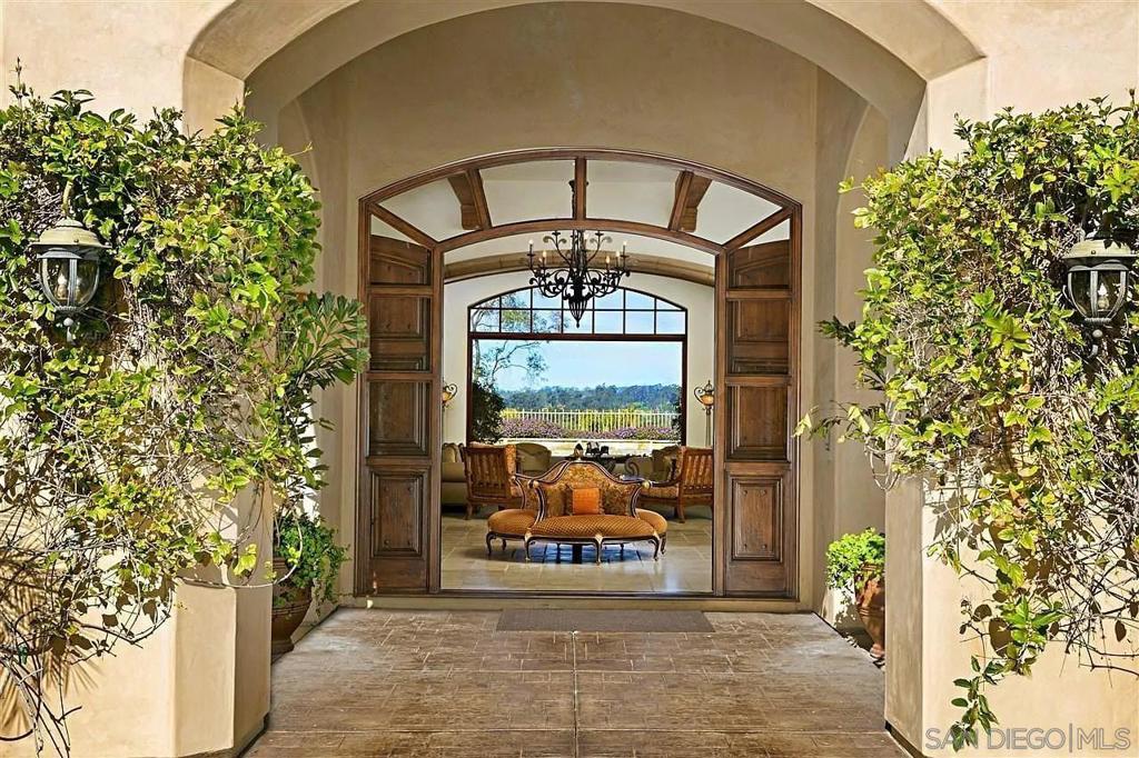 This Beautifully designed and built estate, with stunning panoramic golf and mountain views, is situated on one of the most desirable reimer sites in the prestigious 24- hour guard-gated enclave of Rancho Pacifica in Rancho Santa Fe neighborhood. sited upn a large all usable 1 acre elevated corner lot/protected panoramic views. Perfect floor plan with gorgeous Master Suite on 1st fleve!!!