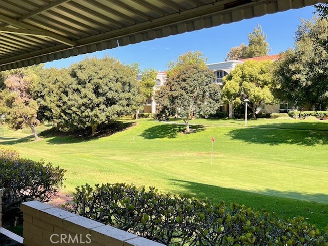 SINGLE LEVEL beautiful END UNIT with a GOLF COURSE VIEW! Located in Laguna Woods Village, an active 55+ Senior Community. NO STAIRS! Convenient ramp access. This Condo has an OVERSIZED GARAGE. Room for your car and golf cart! Enjoy the Wonderful and Peaceful open VIEW of the fairway on the Par 3 course hole 1. Enjoy the large and private patio plus a front courtyard>>>Plenty of guest parking. Cul de Sac. Inside features, includes dual-pane windows, NEW CEILING FANS and NEW custom shades that allow natural light, recessed lighting throughout with dimmer switches and privacy. The Tile floor and newer carpeting leads out to the extensive open patio. There are smooth ceilings, new ceiling fans and upgraded Electrical outlets and switches. The full-size inside washer/dryer adds laundry convenience. The kitchen boasts granite counters, abundant cabinet space, and a window above the sink that welcomes the morning sun. The living room is spacious and offers a FIREPLACE and a delightful view, enhanced by the privacy provided by surrounding trees and shade from the afternoon sun., Your guests will enjoy the beautifully detailed Queen-size MURPHY BED (it shows as a stunning piece of furniture against the wall, but open it and pull down. There is your Bed) in the large second bedroom. The adjacent guest bathroom showcases a Shower/Tub with a Vanity with granite countertops. The primary main bedroom includes an abundance of closet space, a generously sized bathroom with a step-in shower. This remarkable home is ideally situated within Laguna Woods, only 6 miles from Laguna Beach and the Pacific Ocean. Lots of amenities and clubs for you to enjoy.