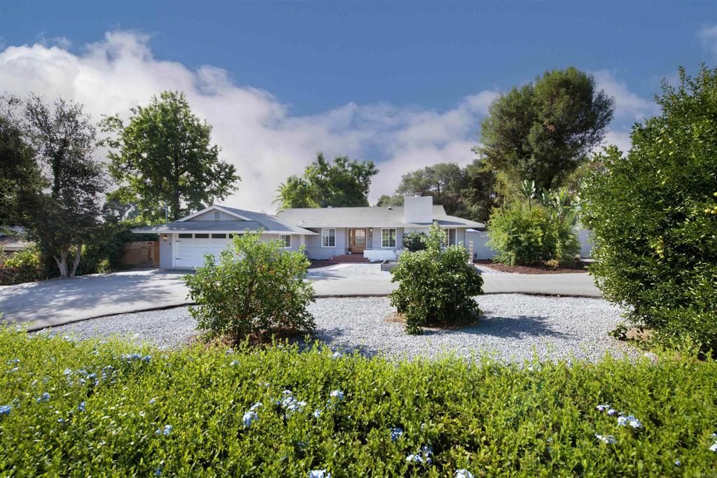 Welcome to 439 Eldorado Drive — a thoughtfully updated 3-bedroom, 2-bath home tucked away on a generous half-acre lot just minutes from the heart of Escondido. Inside, you’ll find inviting spaces filled with natural light. A cozy fireplace anchors the living room, while the open layout makes it easy to gather with family and friends. The kitchen was designed with both function and heart in mind—granite counters, a spacious island, and double convection ovens make it just as perfect for weeknight dinners as for holiday hosting. The bedrooms are roomy and comfortable, with plenty of storage for everyday living. Whether you need a quiet home office or a creative corner, this home has the flexibility to fit your lifestyle. One of the best perks? The fully paid-off solar system - providing you energy savings and peace of mind for years to come. Step outside, and you’ll discover the true magic of this property. Mature oaks and shady trees create a sense of peace and privacy, while the expansive yard offers endless possibilities—gardening, entertaining, or simply enjoying the quiet. The circular driveway and two-car garage make coming home easy, with extra space for RVs, trailers, or boats for those who love adventure. This home beautifully balances the best of both worlds—room to breathe with the convenience of the city close by. Come see why 439 Eldorado Drive feels like the perfect place to put down roots