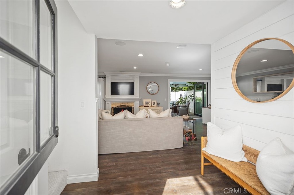 Welcome to coastal living in the private community of El Niguel Terrace, located approximately three miles from Southern California’s renowned beaches.
This upgraded townhome features a spacious open-concept floor plan designed for everyday comfort. The location offers convenient access to Salt Creek, Strand Beach, Dana Point Harbor, as well as nearby shops, restaurants, and the library. Bi-fold doors extend the living area to the backyard, creating seamless indoor/outdoor flow. The backyard includes custom stamped concrete, new fencing, underground drainage, and a built-in shower.
The kitchen is equipped with a custom oak breakfast bar, stainless steel appliances, a large island with quartz countertops, generous storage, and a unique sink design. The main living and dining areas feature shiplap and beadboard accents, 5-inch baseboards, smooth coat ceilings, recessed lighting, upgraded interior doors, and Emtek oil-rubbed bronze hardware. A fireplace, crown molding, surround sound, and a neutral color palette enhance the downstairs living space.
Upstairs are three bedrooms, including a primary suite that can be reconfigured into four bedrooms if desired. The primary suite includes dual closets, a fireplace with sitting area, and a private deck with views of the landscaped greenbelt. Additional upgrades include Energy Star A/C and HVAC, dual-pane windows and doors, enhanced electrical, built-in garage storage and workbench, new flooring, driveway, and roof.
The property’s cul-de-sac location provides reduced through-traffic, while the home itself offers versatile spaces suitable for entertainment, relaxation, or flexible use. Combining thoughtful updates with a functional layout, this residence is well-suited for a variety of lifestyles.