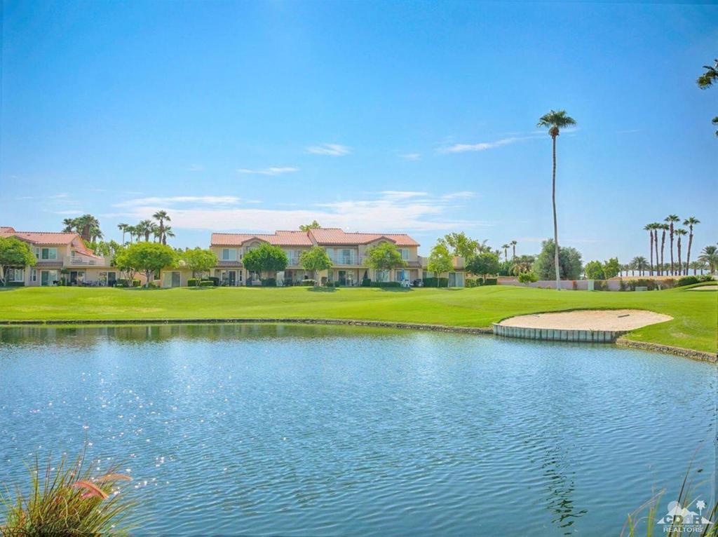 One bedroom, one bath lower level condo with golf course, mountain and lake views. The condo has a stackable washer & dryer inside condo and a one car garage. One of the community pools is right across the street. Palm Royale is a gated community within walking distance to Indian Wells Tennis Gardens. Unlimited golf is included in the HOA dues on the Ted Robinson designed par-3 golf course. This is the Valley's Premier Short Course! Clubhouse & Pro Shop. Minutes from destination golf, dining & shopping. Community amenities include 6 pools & spas, lighted pickle ball and tennis courts and Helix Disc Golf. HOA fees also include basic cable,and internet, landscape maintenance, & trash service.