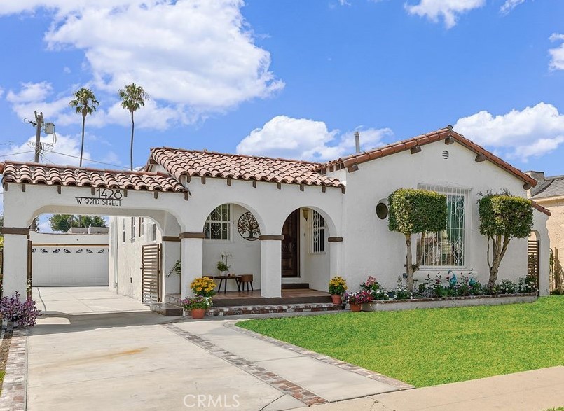 Rare spacious one-level Spanish-style home beautifully renovated blending timeless character with modern luxury. This 1,707 sq ft residence is filled with natural light from numerous new windows dressed with elegant custom drapery.
The home’s curb appeal is highlighted by its Spanish architecture. The flowing layout features a bright living room with arched entryways, NEW recessed lighting, NEW flooring, opening to a formal family room, dinning room, and cozy breakfast nook. The NEW chef’s kitchen shines with quartz countertops, custom cabinetry, and premium NEW KitchenAid appliances. Both bathrooms are fully remodeled with designer finishes and modern details.
Thoughtful upgrades include NEW AC units, fresh interior & exterior paint, NEW doors, NEW windows, and a newly poured concrete driveway and garage. A long gated driveway with a custom high-end NEW iron gate offers RV parking and leads to a detached 2-car garage with excellent ADU potential.
Centrally located just minutes from SoFi Stadium, LAX, USC, Kia Forum, Intuit Dome, Space X, Boeing, Mattel, beaches, and major freeways. This beautiful Spanish home is complete, refined, and ready for luxurious living.