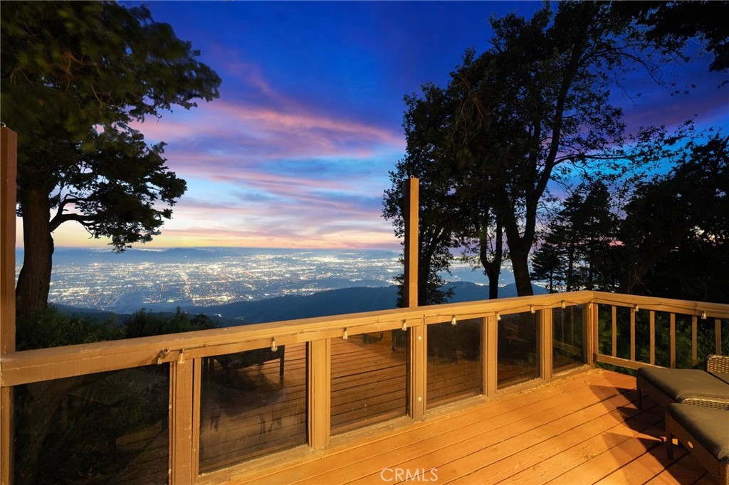 Here, mornings begin not with traffic reports but with sweeping skyline views that remind you why you chose to leave the chaos behind and evenings end with sunsets that no Instagram filter could ever capture.
This 2-bedroom, 3-bathroom cabin isn’t just a home—it’s a chance to reconnect with what matters. Tucked right up against the San Bernardino National Forest, this place offers real mountain living. Not the polished, cookie-cutter version, but a cabin full of character and charm, where craftsmanship and thoughtful design tell stories of a time when homes were built to last. Sitting on a generous 8,990-square-foot lot, there's room to spread out—host a summer BBQ under the pines, build a tree fort with the kids, or simply enjoy the rare quiet that comes without sirens, car horns, or crowded sidewalks.
And when you’re ready for some adventure, you're minutes from Lake Gregory and Lake Arrowhead. Whether it's kayaking at sunrise, hiking nearby trails, or spending lazy afternoons by the water, this location makes weekend getaways feel like part of your everyday routine.
In a world that demands constant connectivity, this cabin offers the radical luxury of disconnection. Here, success isn't measured in notifications or deadlines, but in the number of sunsets you actually stop to watch and the conversations that stretch long into the night because there's nowhere else you'd rather be.