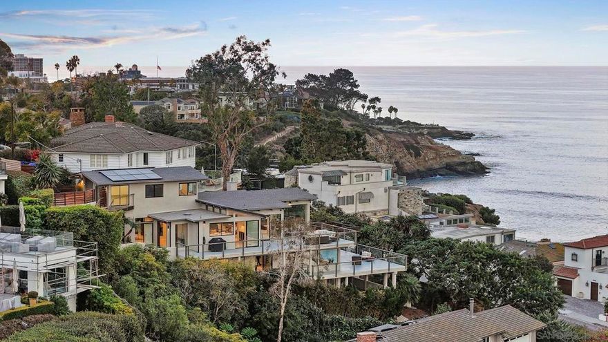 Tucked away at the end of Ludington Lane, this recently remodeled hillside home blends privacy, comfort, and sweeping ocean views. Nearly every room showcases the coastline, with expansive windows and terraces that connect indoor and outdoor living.  The four bedrooms each feature en-suite baths and access to view decks, while the primary suite offers a spa-like bath, walk-in closet, and a spacious terrace overlooking the horizon.  Just minutes from The Village of La Jolla, enjoy world-class dining, boutique shopping, and iconic beaches—while returning home to your own private sanctuary.