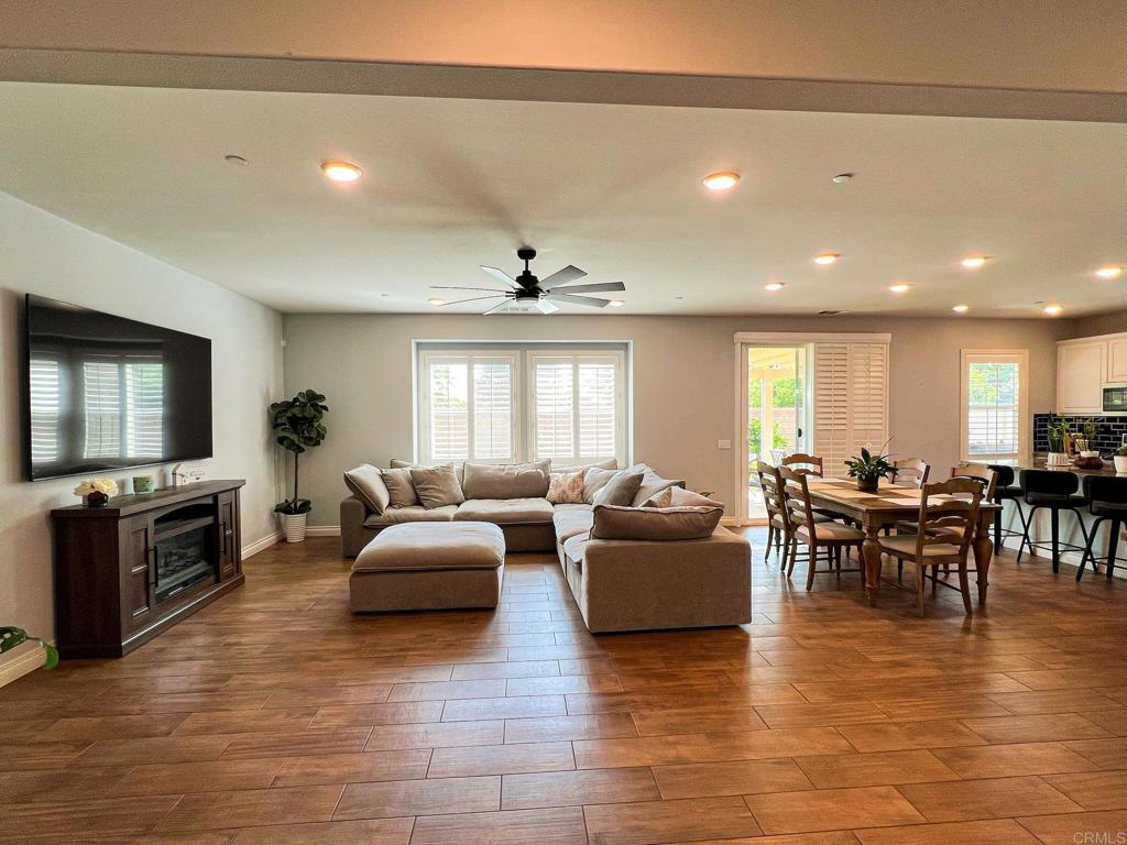 Tucked away at the end of a peaceful cul-de-sac, just a 15-second stroll to a park and sport court, your dream home is waiting. Step inside and feel the openness of the bright, airy floor plan. The living space flows seamlessly into the heart of the home—a large, modern kitchen with LED lighting glowing under the cabinets, setting the perfect mood for cooking or entertaining. The warm, wood-like tile flooring stretches across the living areas, adding both elegance and durability. Imagine laughter and conversations echoing through the open space as sunlight filters in. Three spacious bedrooms offer comfort and privacy, while two well-appointed bathrooms make daily life effortless. Slide open the back doors and step into your pool-sized backyard—the perfect blank canvas for summer barbecues, birthday parties, or your future dream pool. And with a solar system already in place, you’ll keep your energy bills low while keeping your home cool all year long. This isn’t just a house—it’s a lifestyle. Quiet, connected, and ready for your next chapter.