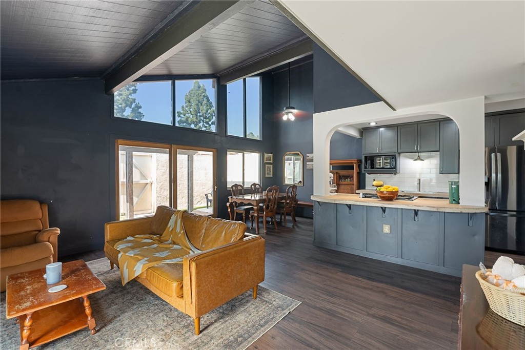 FHA-approved and stylishly updated, this modern industrial condo offers comfort, character, and thoughtful upgrades throughout. Featuring an open floor plan with vaulted ceilings and oversized windows, the space is flooded with natural light. This 2-bedroom, 1.5-bath home offers nearly 1,000 square feet of inviting living space with waterproof luxury vinyl plank flooring and plantation shutters in both bedrooms. The kitchen shines with modern cabinetry, a newly added backsplash, sealed concrete countertops, stainless steel appliances (including a gas range/oven, microwave, and sink), and an island with bar-top seating, ideal for entertaining. Recent upgrades include an energy-efficient tankless water heater, new front window and patio door replacements, and smart home features like a Ring doorbell and Nest thermostat. Through oversized sliding doors, step onto your private 300 SF covered patio with brick flooring and planters, perfect for indoor-outdoor living year-round. A detached garage is located just steps away for added convenience. Centrally located about 35 minutes from Mount Baldy and within walking distance to shopping centers and the mall, the home also offers easy access to the 10, 60, and 210 freeways. It’s just a 10-minute drive east or west to nearby Metrolink stations. Outdoor enthusiasts will love the nearby dog park off 11th Street and the scenic Pacific Trail. And for college students, Claremont McKenna College is only 6 minutes away. Move-in ready and priced to sell, don’t miss your chance to own this stylishly updated gem!