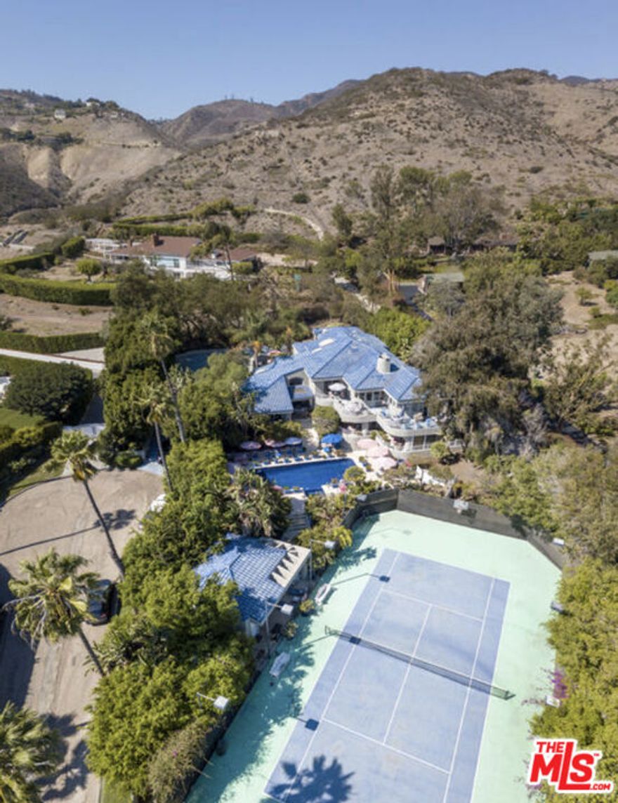 Unique JV opportunity. short-term seller financing and/or creative structuring available. Nestled in one of Malibu's most coveted areas. Set on a flat acre, this approximately 5,200+ square-foot estate boasts ocean views and complete privacy. The property offers immense potential for Developers or end-users looking for their dream coastal home. In addition to ocean views and serene privacy, the estate features a tennis court, a guest house, an expansive motor court, and ample room for further expansion. The property is conveniently located near Malibu's finest dining, shopping, and entertainment options. The home has some deferred maintenance and is being sold as-is. Showings are by appointment only.