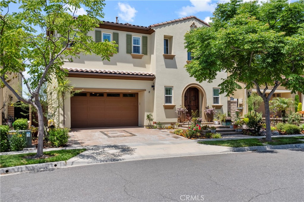 Welcome to 46 Dogwood, a beautifully upgraded 5-bedroom, 5.5-bathroom Toll Brothers home offering 3,273 square feet of luxury living in the prestigious Highlands neighborhood of Baker Ranch. This exceptional property includes a ground level casita with its own private entrance, living room, kitchenette, bedroom, and full bath—perfect for guests, multi-generational living, or a private office.
With over $300,000 in designer upgrades, this home offers a blend of refined elegance and modern comfort. From the grand double-door entry, you’re welcomed into a dramatic two-story foyer with a sweeping curved staircase and thoughtfully designed built-ins that set the stage for the rest of the home.
The open floor plan is flooded with natural light and features a cozy fireplace, generous living areas, and a chef-inspired kitchen with an oversized quartz island, wraparound breakfast bar, full-height soft-close cabinetry, built-in refrigerator, high-end stainless steel appliances, farmhouse sink, walk-in pantry, reverse osmosis system, built-in desk, drop zone, and designer lighting. Expansive pocketing glass doors open to a stunning California Room, outfitted with custom cabinetry, a wine and beverage refrigerator, and motorized screens and drapes for ideal indoor-outdoor entertaining.
Each bedroom includes its own ensuite bathroom, and the luxurious primary suite offers tray ceilings, dual walk-in closets with custom organizers, a spa-like bath with an oversized shower and soaking tub, and pocket glass doors that open to a private deck with scenic hillside views.
Additional features include smart home technology such as video doorbell, smart locks, thermostats, and a smart garage opener. The garage is finished with epoxy floors, built-in cabinets, overhead storage, a workbench, EV charger, and a whole-home water softener and filtration system. The home is also equipped with a 5.2 kW Tesla solar system for added energy efficiency.
Located in the resort-style community of Baker Ranch, residents enjoy access to multiple parks, six heated pools and spas, scenic trails, fitness areas, clubhouses, BBQ stations, fire pits, sport courts, and a dog park—all with no Mello-Roos and low HOA dues. This is an incredible opportunity to own a turnkey luxury home in one of Lake Forest’s most desirable neighborhoods.