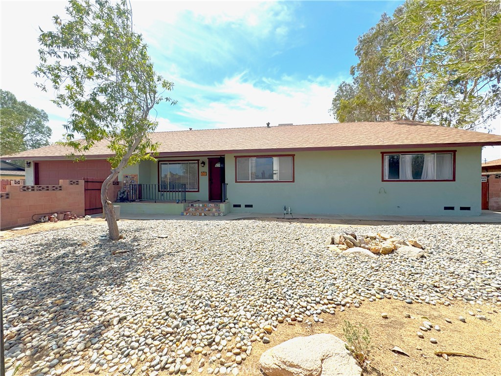 Spacious single-story home in Ridgecrest offering solar power, a large lot, and versatile indoor and outdoor living. This 3-bedroom, 2-bath residence blends comfort with functionality, featuring open living areas, updated finishes, and abundant storage throughout.
The kitchen is the centerpiece of the home, offering a central island, extensive cabinet space, a modern backsplash, and stainless steel appliances. A walk-in pantry provides exceptional storage, making meal preparation and organization effortless. Multiple living and dining areas flow together with bright natural light, updated flooring, and ceiling fans for year-round comfort.
Each bedroom is designed for flexibility, with ample closet space and generous layouts. The bathrooms are updated with clean finishes, including tile surrounds and modern vanities. A bonus room adds additional value, offering space for a home office, hobby room, or workshop.
The oversized garage includes shelving and room for vehicles, projects, or additional storage. A laundry room with built-ins makes everyday living efficient and convenient.
Outdoor spaces are designed for enjoyment and practicality. The expansive covered patio extends the living area outdoors, perfect for gatherings, BBQs, or relaxing in the shade. The backyard offers mature trees, privacy fencing, and room for gardening, pets, or recreation. A detached bonus structure provides additional options for storage, hobbies, or workspace. Gated side access accommodates extra parking or recreational vehicles.
Located in a quiet Ridgecrest neighborhood, this property combines energy efficiency with modern convenience. Solar panels help lower utility costs, while thoughtful upgrades provide long-term value. With its spacious floor plan, multiple storage solutions, and functional outdoor areas, this home is move-in ready and designed to fit a variety of lifestyles.