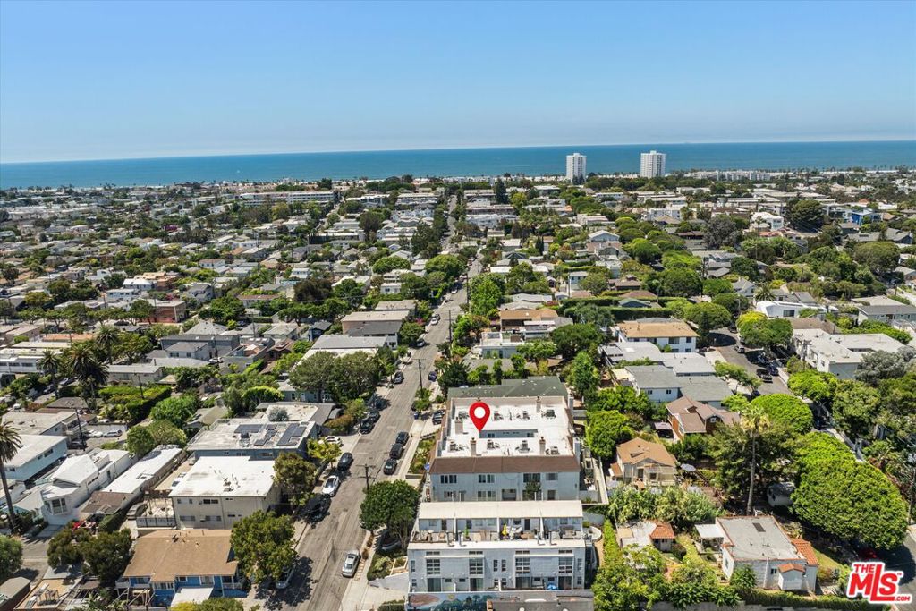 Welcome to one of Ocean Park's most exceptional front-facing corner townhomes, perched high above the street for enhanced privacy, incredible natural light, and sweeping views from nearly every window on both levels. Located west of Lincoln at 737 Pier Ave, this newly renovated 2 bedroom, 2.5 bath residence spans approximately 1,500 square feet but feels significantly larger thanks to its open-concept layout, vaulted ceilings, and thoughtfully designed flow. This is true turnkey livingjust bring your toothbrush. Renovated with precision and high-end taste, the home features wide-plank oak flooring, custom white oak cabinetry, Caesarstone countertops, new windows and doors, and a crisp, modern aesthetic that rivals multi-million-dollar properties. The expansive living room opens to a rare full-width, private front patioperfect for entertaining, lounging, or enjoying ocean breezes year-round. Upstairs, you'll find two large primary suites, each with its own beautifully appointed en-suite bathroom. The front-facing suite also includes a private balcony with stunning southwest-facing views of the ocean, city lights, and Marina del Rey. With limited shared walls, in-unit laundry, two side-by-side garage parking spaces, and two enormous private storage rooms, the home is as functional as it is beautiful. The building is well maintained with low HOA dues and a friendly, tight-knit community. All of this, just blocks from Santa Monica and Venice beaches, surf breaks, bike paths, Main Street, Rose Avenue, Abbot Kinney, Whole Foods, and some of the best cafs, restaurants, and shopping on the Westside. A truly rare offering in one of L.A.'s most vibrant coastal neighborhoods. See PVT remarks for all showing requests.
