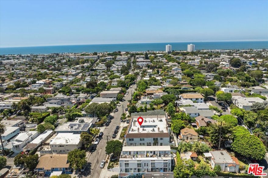 Welcome to one of Ocean Park's most exceptional front-facing corner townhomes, perched high above the street for enhanced privacy, incredible natural light, and sweeping views from nearly every window on both levels. Located west of Lincoln at 737 Pier Ave, this newly renovated 2 bedroom, 2.5 bath residence spans approximately 1,500 square feet but feels significantly larger thanks to its open-concept layout, vaulted ceilings, and thoughtfully designed flow. This is true turnkey livingjust bring your toothbrush. Renovated with precision and high-end taste, the home features wide-plank oak flooring, custom white oak cabinetry, Caesarstone countertops, new windows and doors, and a crisp, modern aesthetic that rivals multi-million-dollar properties. The expansive living room opens to a rare full-width, private front patioperfect for entertaining, lounging, or enjoying ocean breezes year-round. Upstairs, you'll find two large primary suites, each with its own beautifully appointed en-suite bathroom. The front-facing suite also includes a private balcony with stunning southwest-facing views of the ocean, city lights, and Marina del Rey. With limited shared walls, in-unit laundry, two side-by-side garage parking spaces, and two enormous private storage rooms, the home is as functional as it is beautiful. The building is well maintained with low HOA dues and a friendly, tight-knit community. All of this, just blocks from Santa Monica and Venice beaches, surf breaks, bike paths, Main Street, Rose Avenue, Abbot Kinney, Whole Foods, and some of the best cafs, restaurants, and shopping on the Westside. A truly rare offering in one of L.A.'s most vibrant coastal neighborhoods. See PVT remarks for all showing requests.