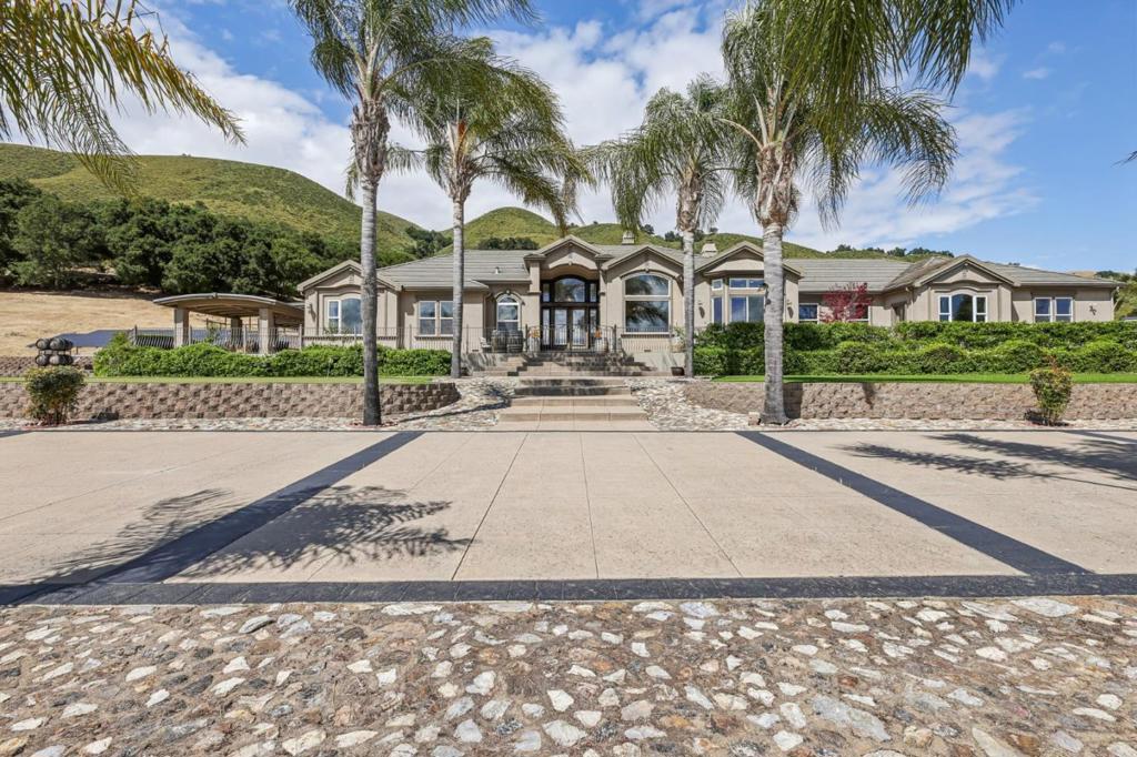 NOT 1 BUT 2 Custom-Built Homes on 40+ Acres in Santa Clara Valley Wine Country! This stunning estate features a 5,600 sq ft main home with 5 beds, 4 baths plus a bonus room/den, soaring 14-ft ceilings, mahogany built-ins, and a Chefs Kitchen with Viking appliances, granite counters, double ovens, wine fridge, and a large walk-in pantry. The 1,416 sq ft second home offers 3 beds and 2 baths perfect for extended family or rental income. Privately situated with breathtaking views, the property is currently used for weddings and special events. Resort-style amenities include a pool/spa, expansive deck with gazebo, tennis court, basketball court, and private hiking/biking trails. Plenty of guest parking and garage space for 10 cars. Ideal for multi-generational living, income potential, or your own private retreat in the heart of wine country.