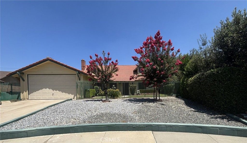Opportunity is knocking! Large family home in the heart of Riverside. Located close to schools, freeway access and shopping. This 4 bedroom and 2.5 bath home is on a wonderfully gated lot. Enclosed patio/garage has it's own bathroom for possible additional living space or extra storage. Home features include: tile roof, whole house fan, maintained landscape, sprinkler system, block wall fencing in back, gated front yard. This property is ready for a fresh start. Some interior cosmetic updates are needed, and buyers should be aware that the home has been smoked in. Sellers have priced accordingly. It's a perfect project for someone with vision!