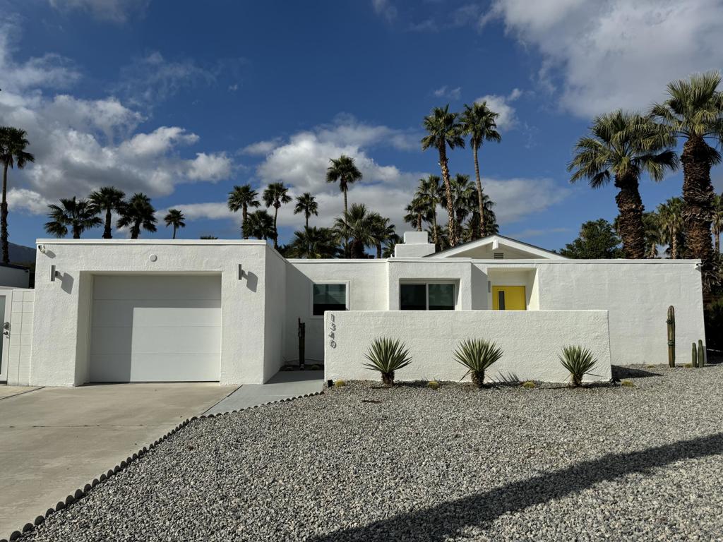 Explore the allure of 1340 East Gem Circle, nestled in the scenic landscape of Palm Springs. This delightful single-family dwelling presents 2 bedrooms and 2 bathrooms within its 1,212 square feet expanse. As you approach, the charming front yard, graced by elegant palm trees, immediately captures your gaze. Inside, discover a spacious living room that seamlessly connects to the outdoor oasis featuring a sparkling pool and inviting spa. Pendant lighting and lofty ceilings enhance the ambiance of this welcoming space. The dining area and kitchen harmoniously coexist within the living area, offering modern amenities like a dishwasher, gas stovetop, and ample cabinet storage. Both bedrooms are bathed in natural light, creating a refreshing and open atmosphere, awaiting your personal touches. The 2 bathrooms feature walk-in showers with intricately designed walls, adding a touch of luxury to everyday living. The backyard provides an ideal setting to unwind and bask in the sun, featuring a refreshing pool and spa area. Conveniently located near parks, schools, the Agua Caliente Casino, and renowned golf resorts such as Escena Golf Resort and Cimarron Golf Resort, this property seamlessly blends leisure and practicality. Embracing the vibrant spirit of Palm Springs, this residence stands as a coveted destination, especially amidst the warmth of summer.